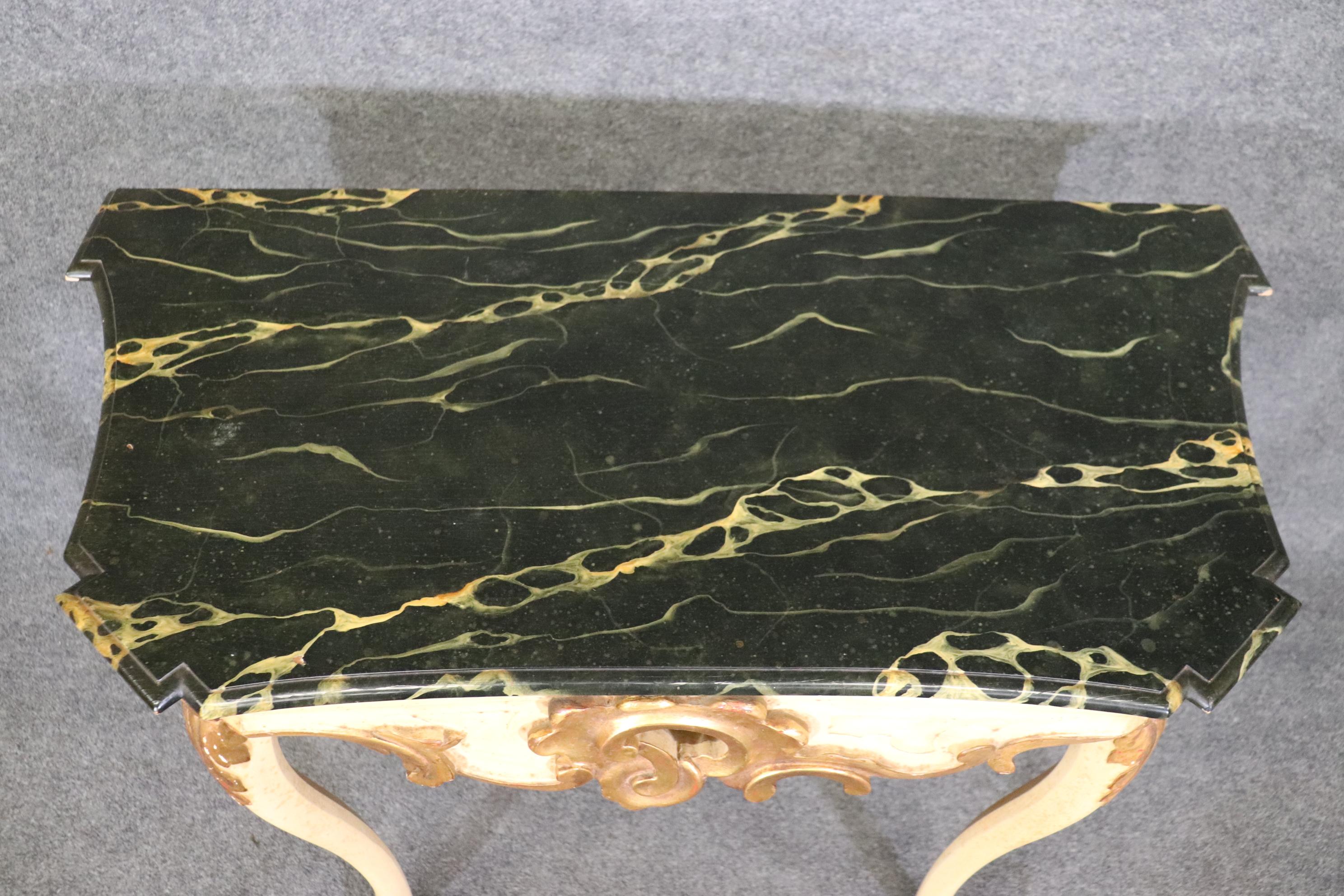 This is a nice faux marble paint decorated Baker Furniture console table in the Louis XV style. The table is over 50 years old and will show signs of age and use. The table measures 44.25 wide x 31.25 tall x 21.75 deep. The table dates to the 1970s