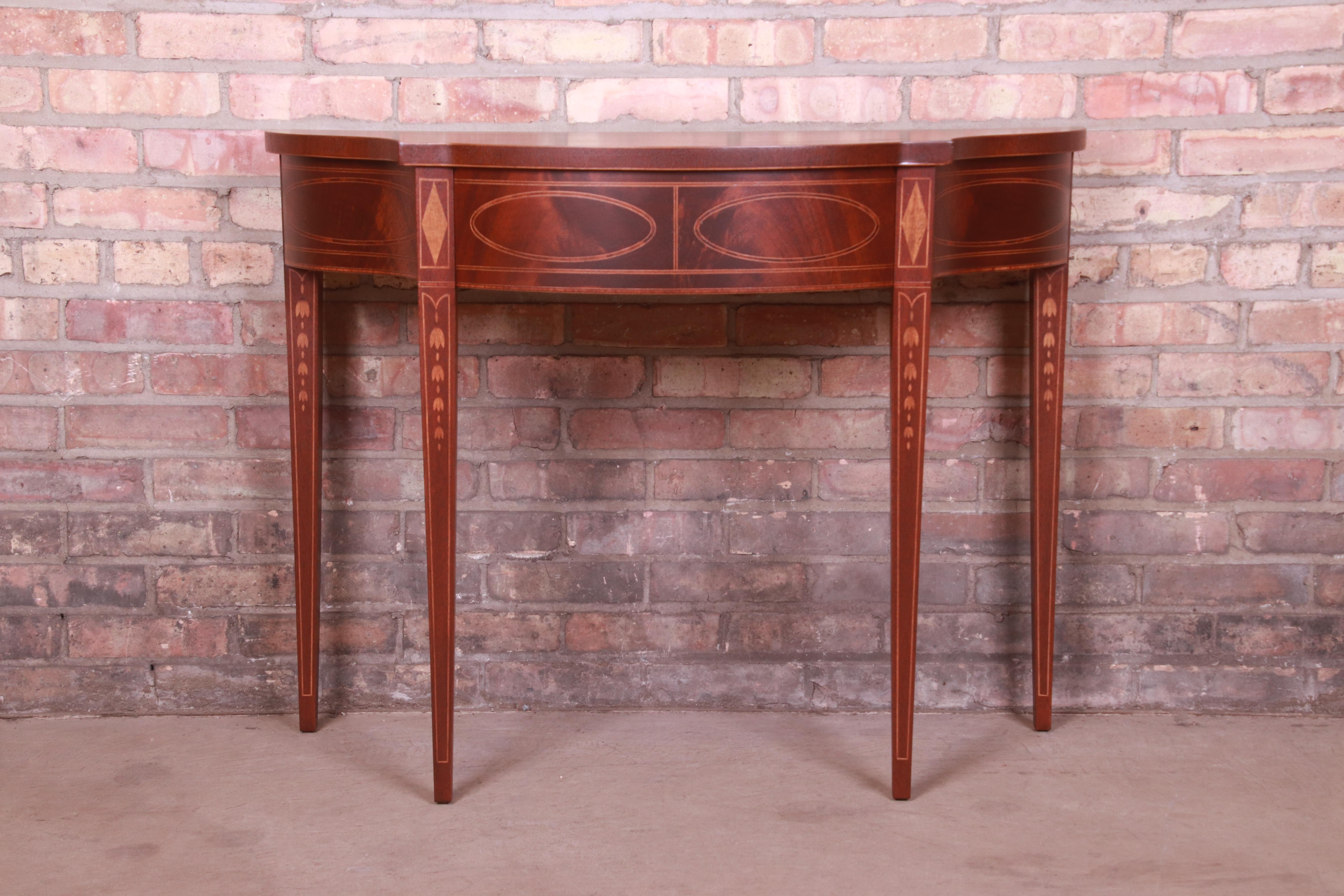 A gorgeous Federal or Hepplewhite style console or entry table

By Baker Furniture, 