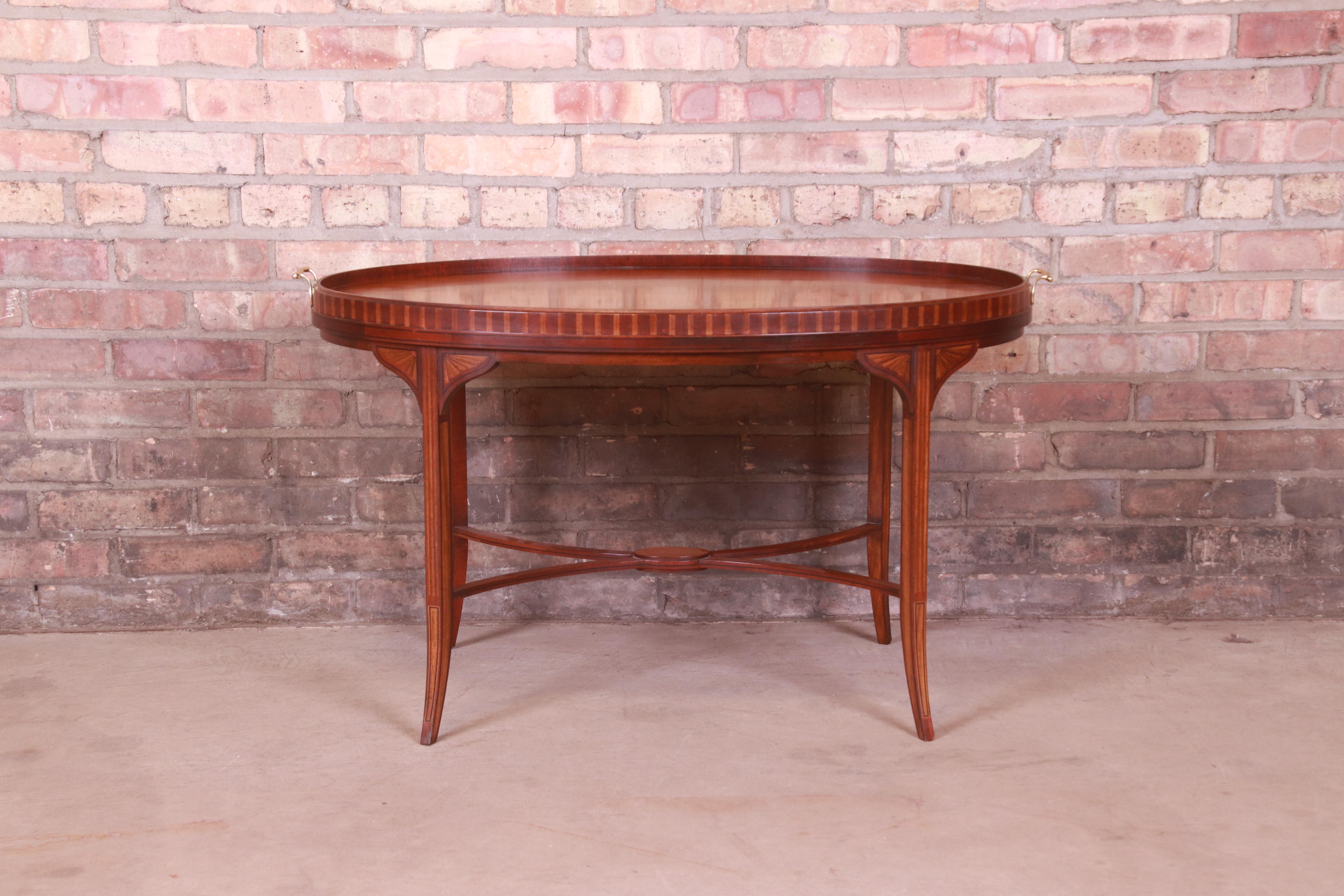 An exceptional Federal or Georgian style coffee or tea table

By Baker Furniture, 