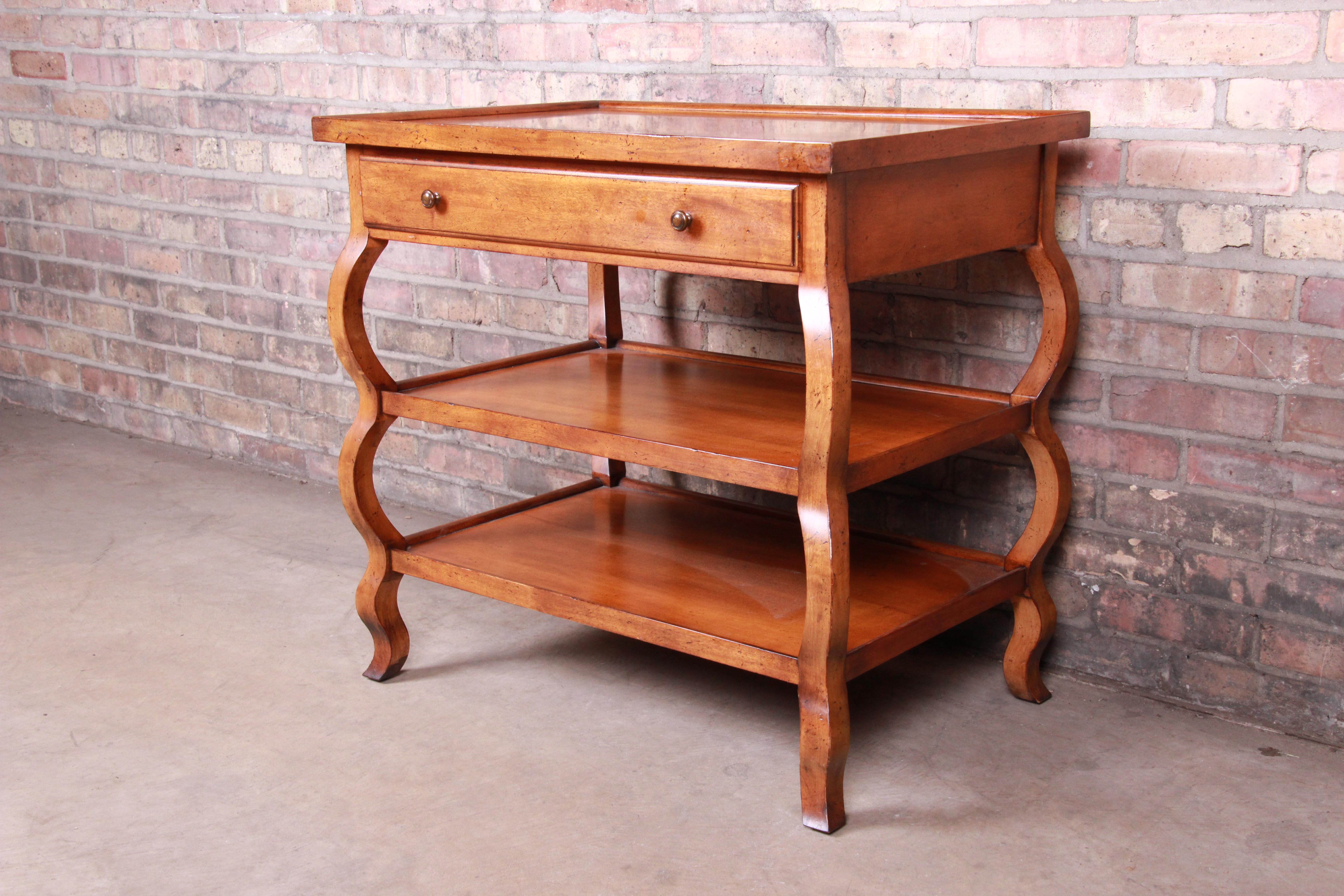 A gorgeous French Country three-tier large nightstand or end table

By Baker Furniture

USA, circa 2000

Measures: 30