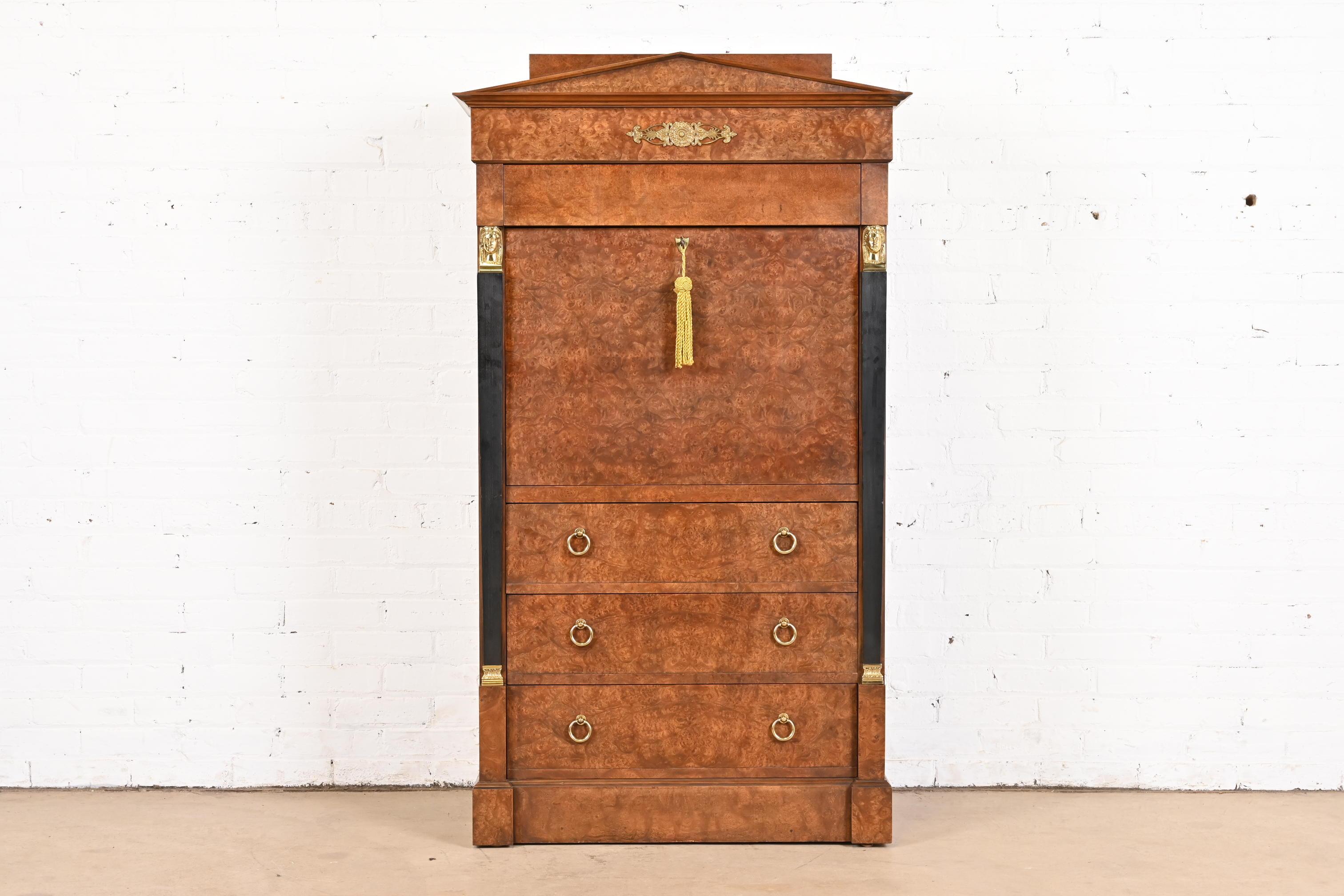 An outstanding French Empire or Neoclassical style drop front secretary desk

By Baker Furniture

USA, Circa 1980s

Gorgeous burl wood, with ebonized columns, and original brass hardware and mounted ormolu. Desk locks, and original key is
