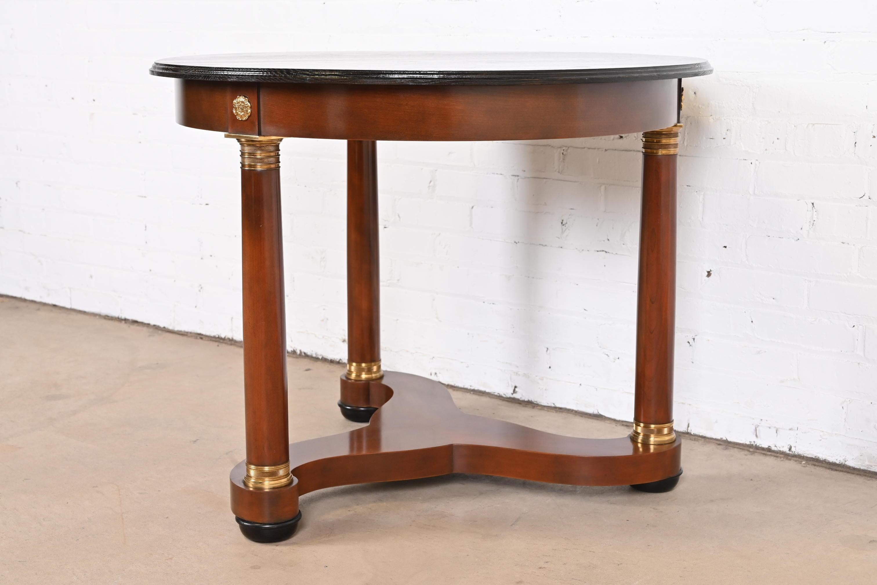 20th Century Baker Furniture French Empire Cherry Wood, Brass, and Ebonized Center Table For Sale