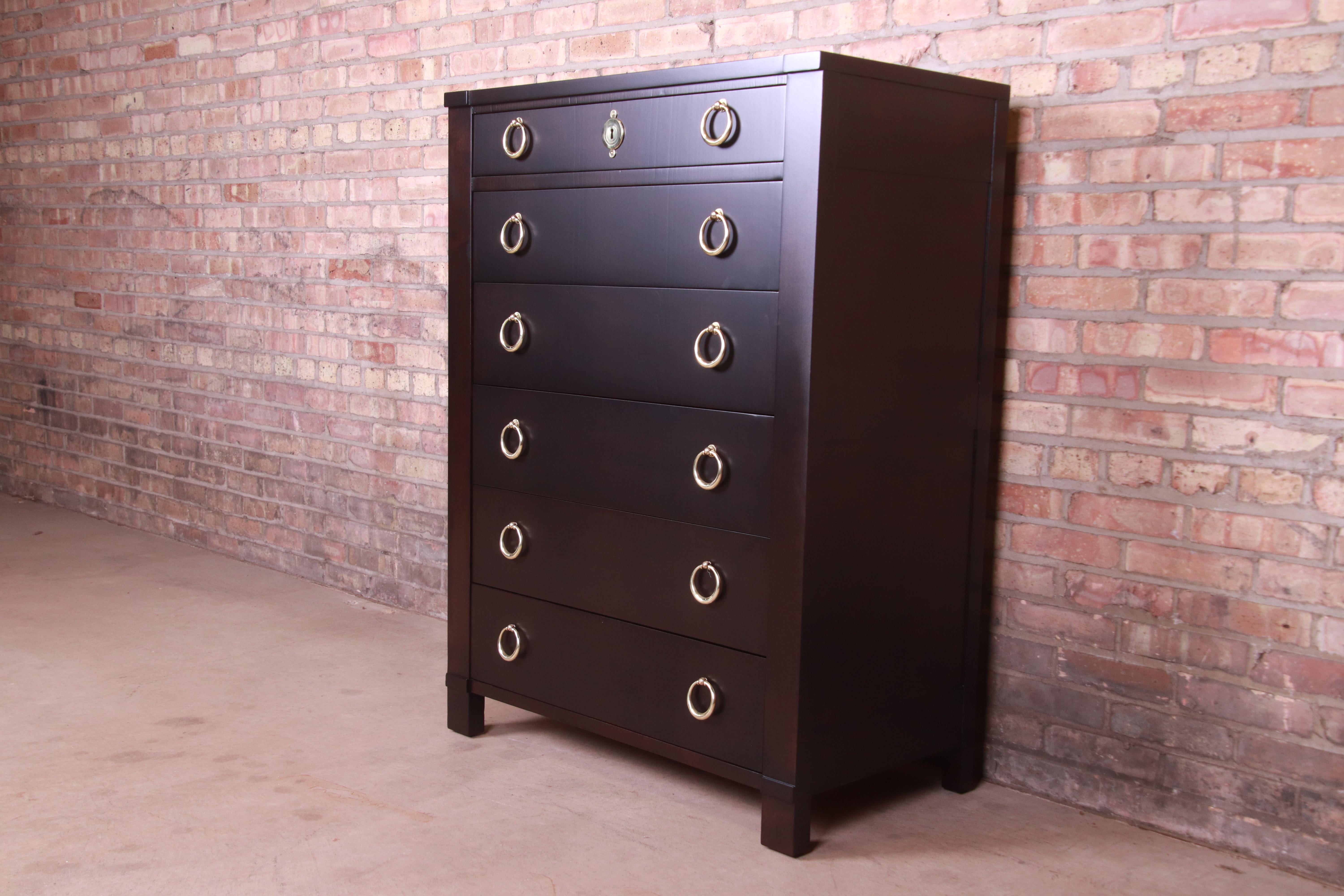 An exceptional mid-century French Empire or Regency style six-drawer highboy dresser

By Baker Furniture

USA, Circa 1960s

Ebonized walnut, with original brass hardware.

Measures: 34