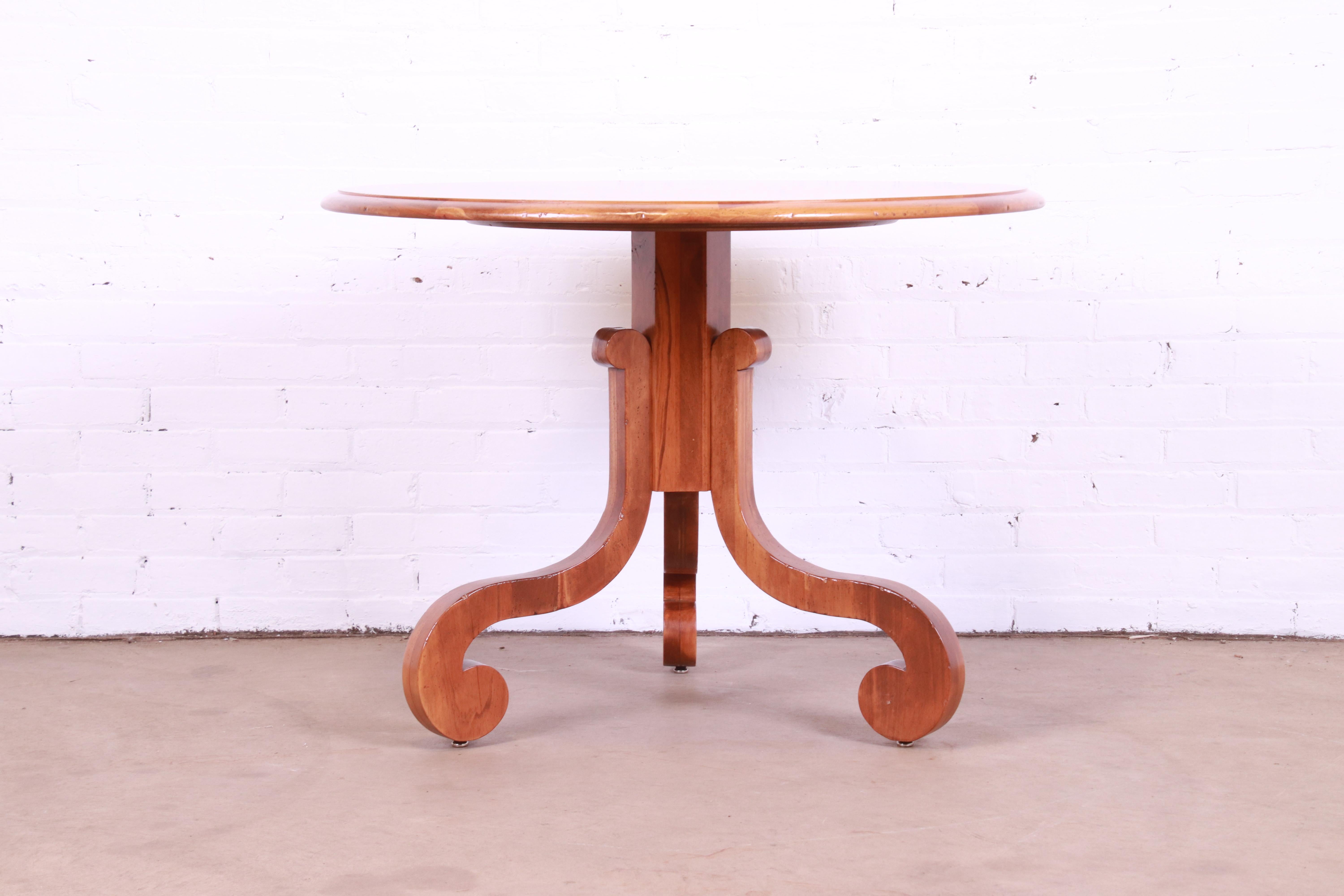 A gorgeous French Empire style fruitwood pedestal breakfast table or center table

By Baker Furniture, 