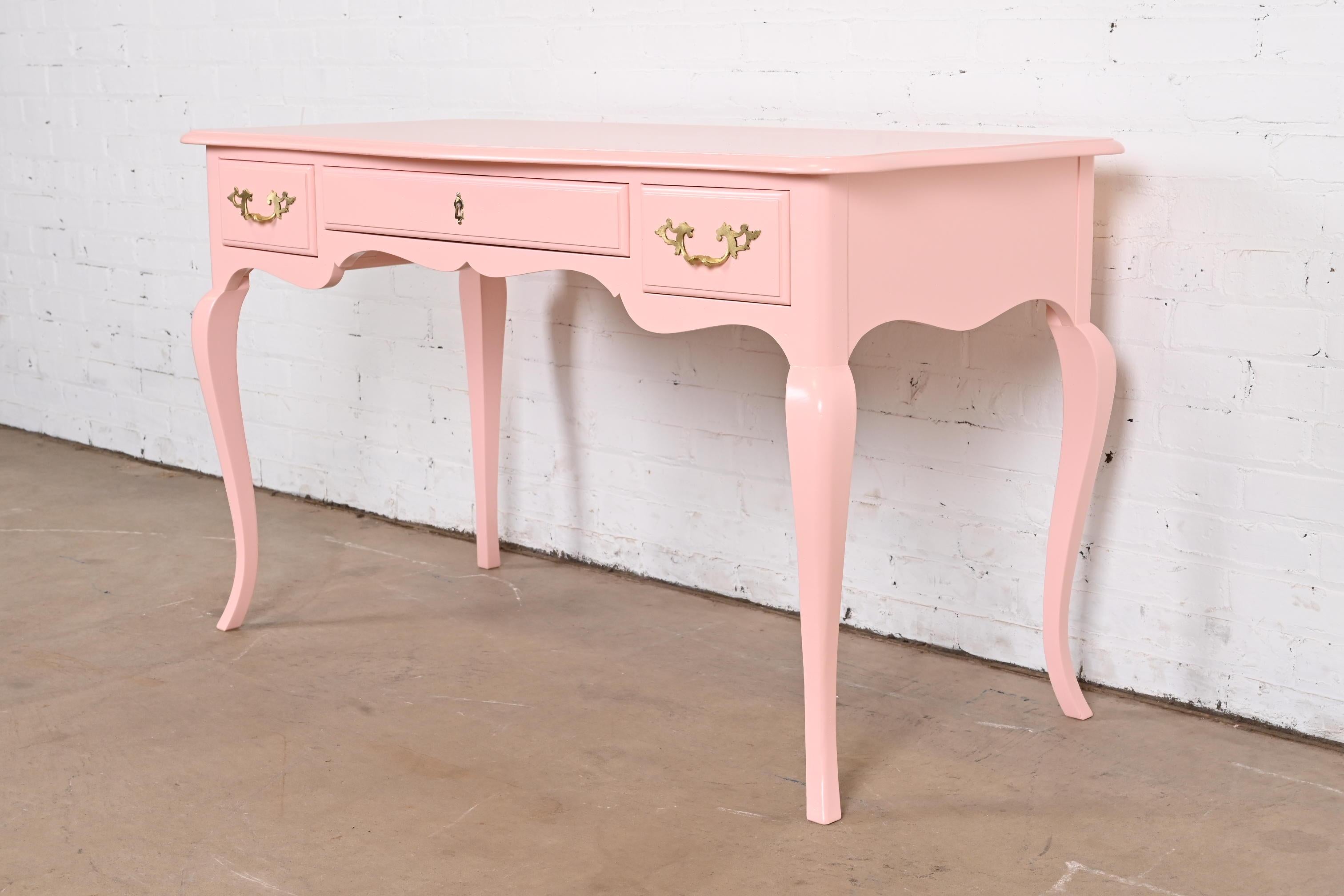 An exceptional French Provincial Louis XV style writing desk

By Baker Furniture

USA, Circa 1960s

Pink lacquered cherry wood, with original brass hardware.

Measures: 50.5