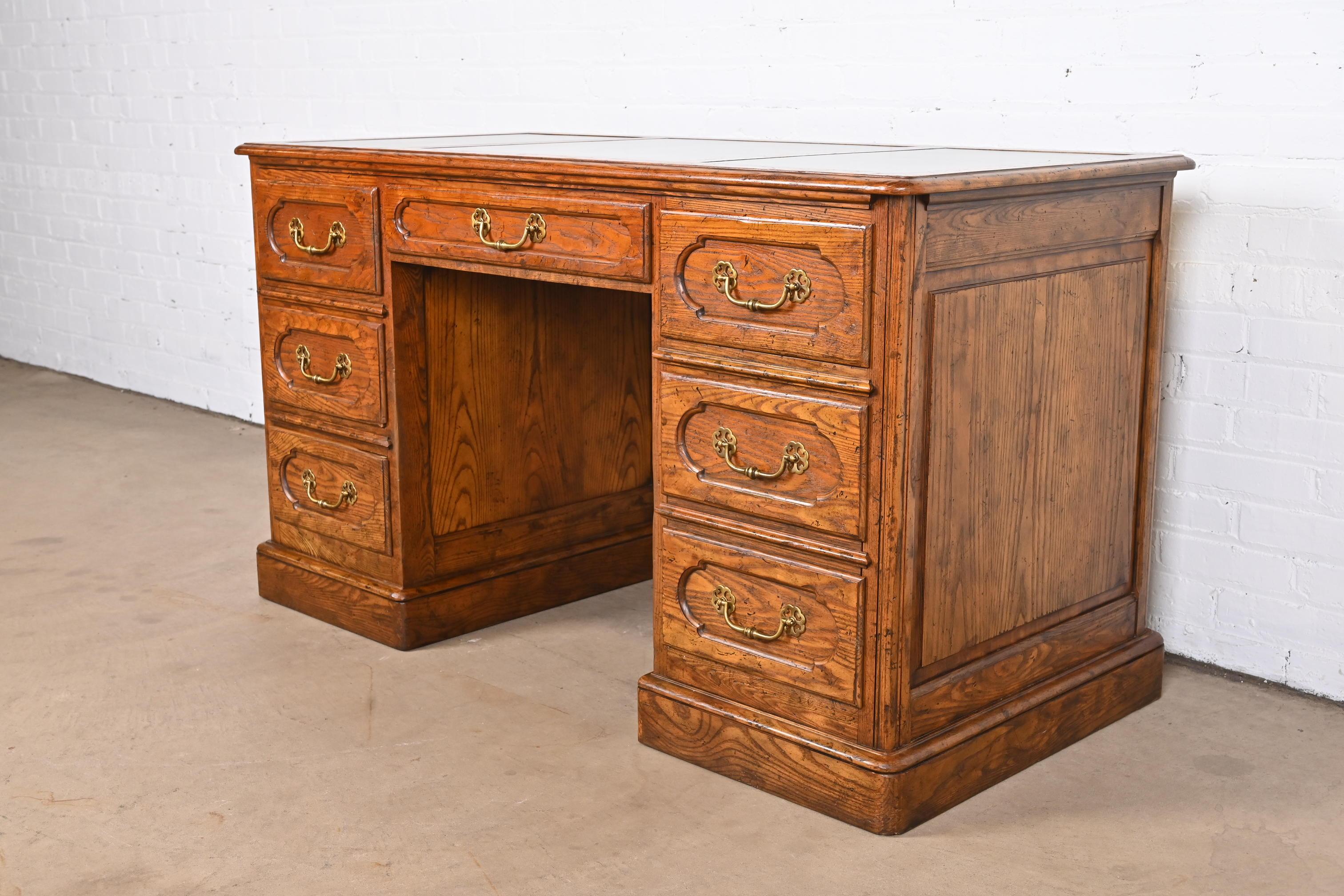 20th Century Baker Furniture French Provincial Carved Oak Leather Top Desk, circa 1960s