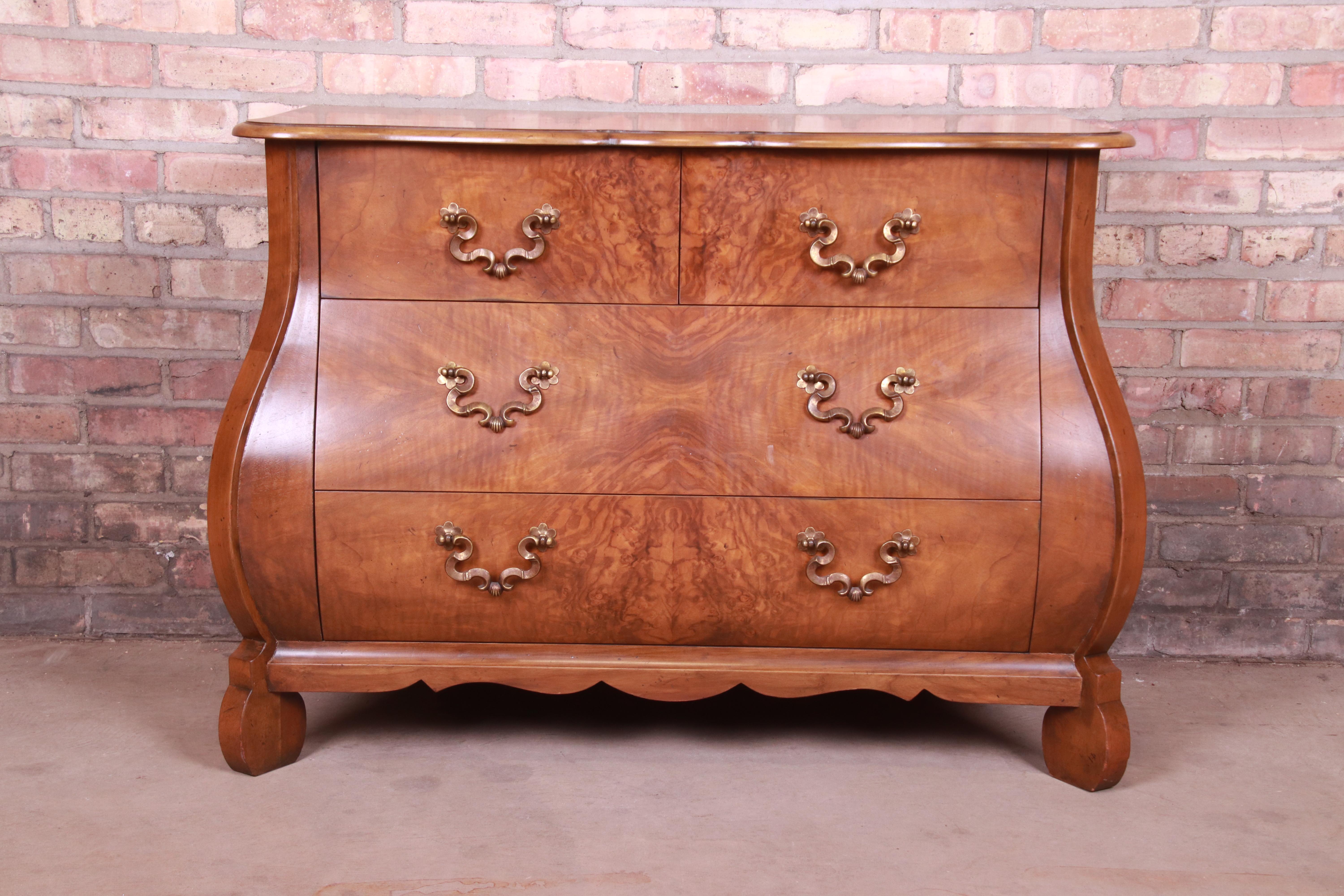 A gorgeous French Provincial Louis XV style bombay chest or commode

By Baker Furniture

USA, circa 1980s

Burled walnut, with original brass hardware.

Measures: 42.5