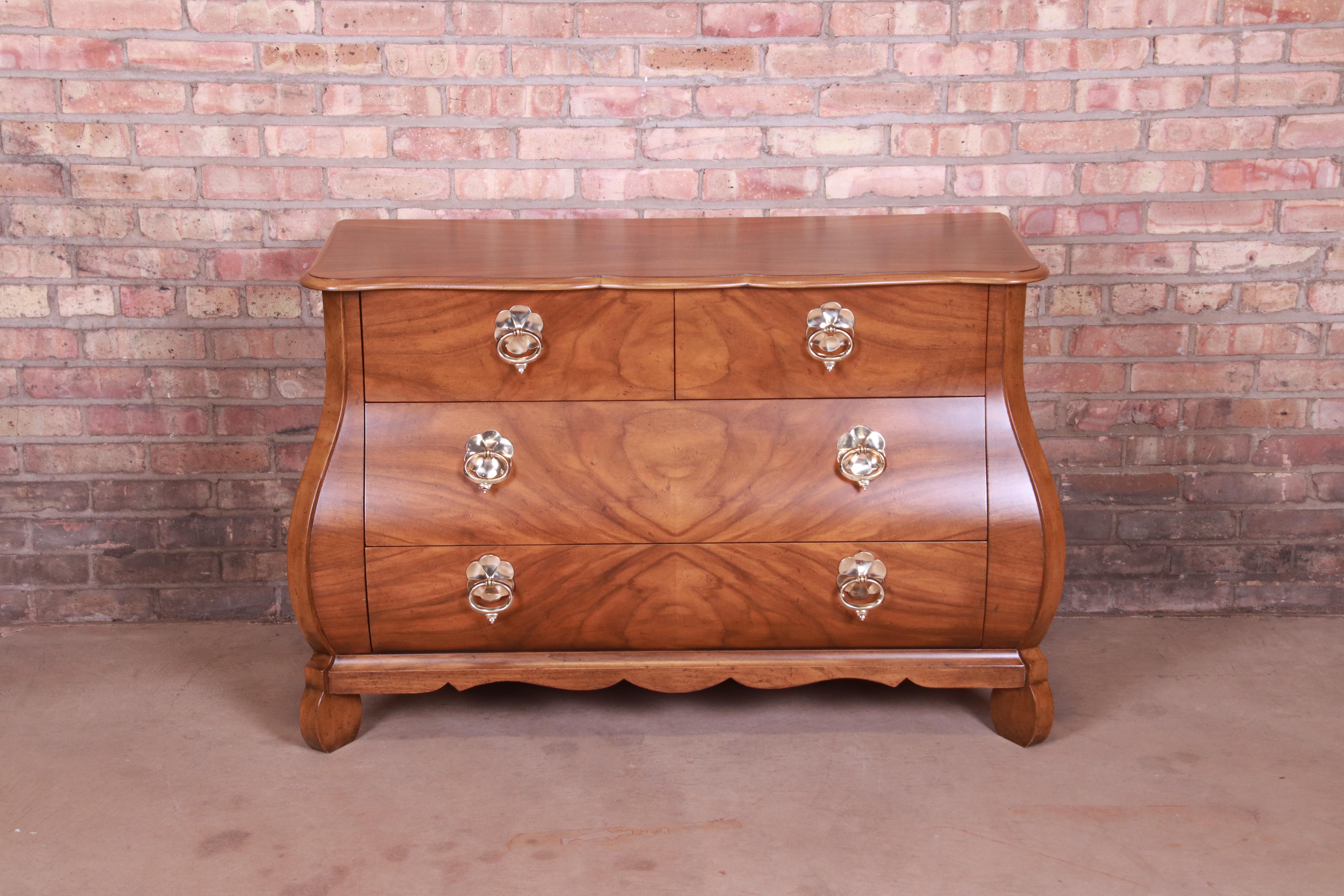 A gorgeous French Provincial Louis XV style bombay chest or commode

By Baker Furniture

USA, circa 1960s

Burled walnut, with original brass hardware.

Measures: 44.75