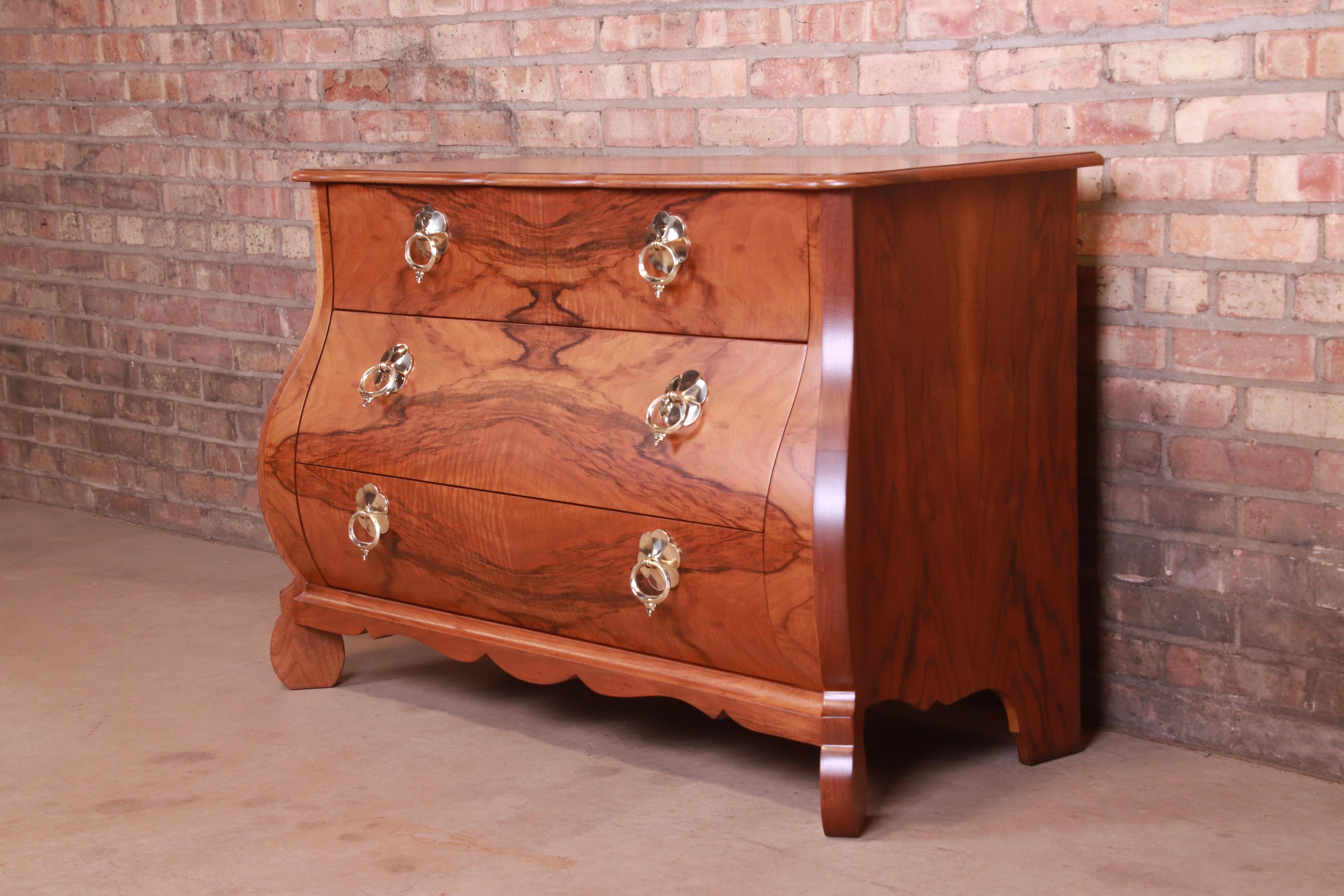 A gorgeous French Provincial Louis XV style bombay chest or commode

By Baker Furniture

USA, Circa 1960s

Burled walnut, with original brass hardware.

Measures: 47