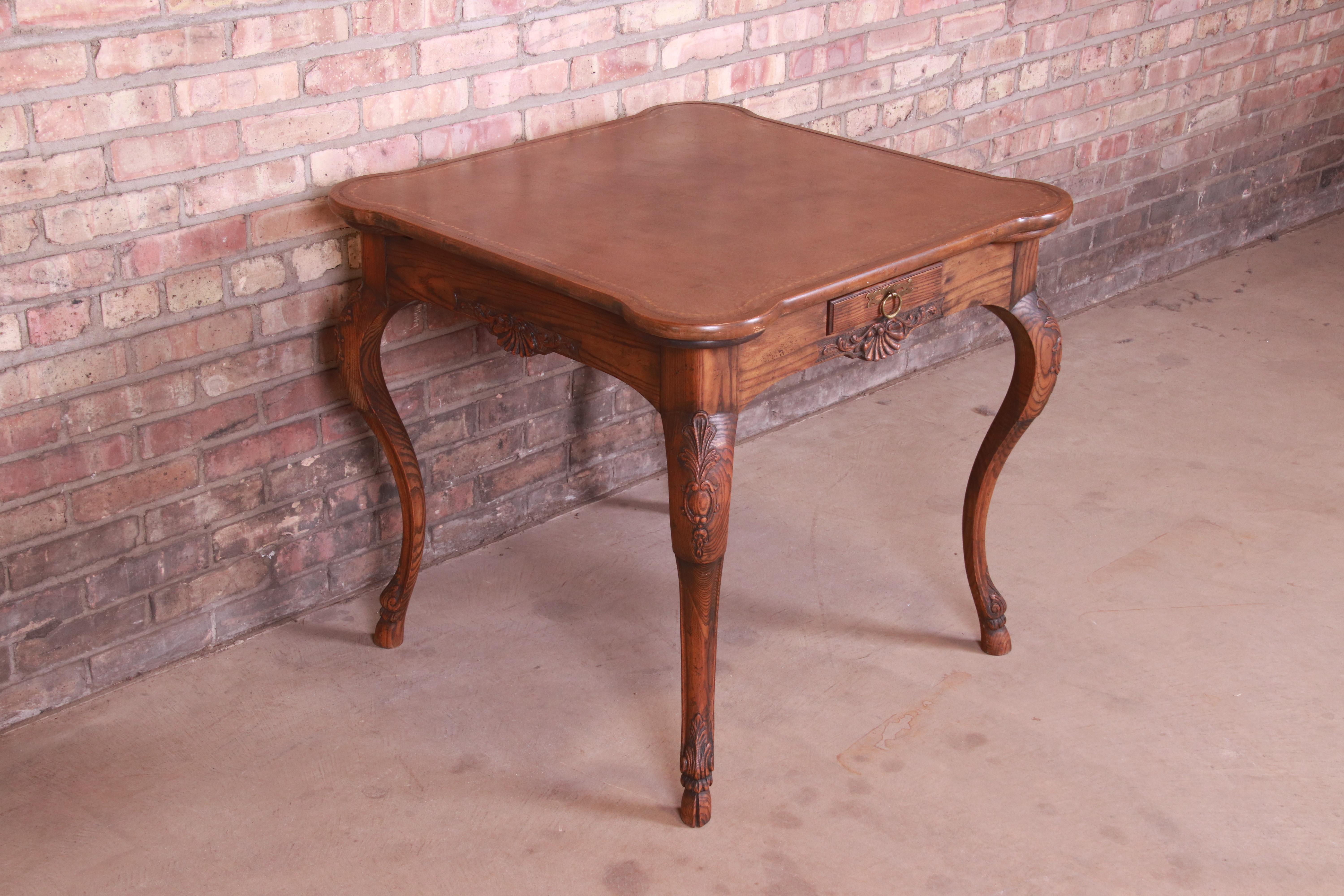 Mid-20th Century Baker Furniture French Provincial Louis XV Carved Oak Leather Top Game Table