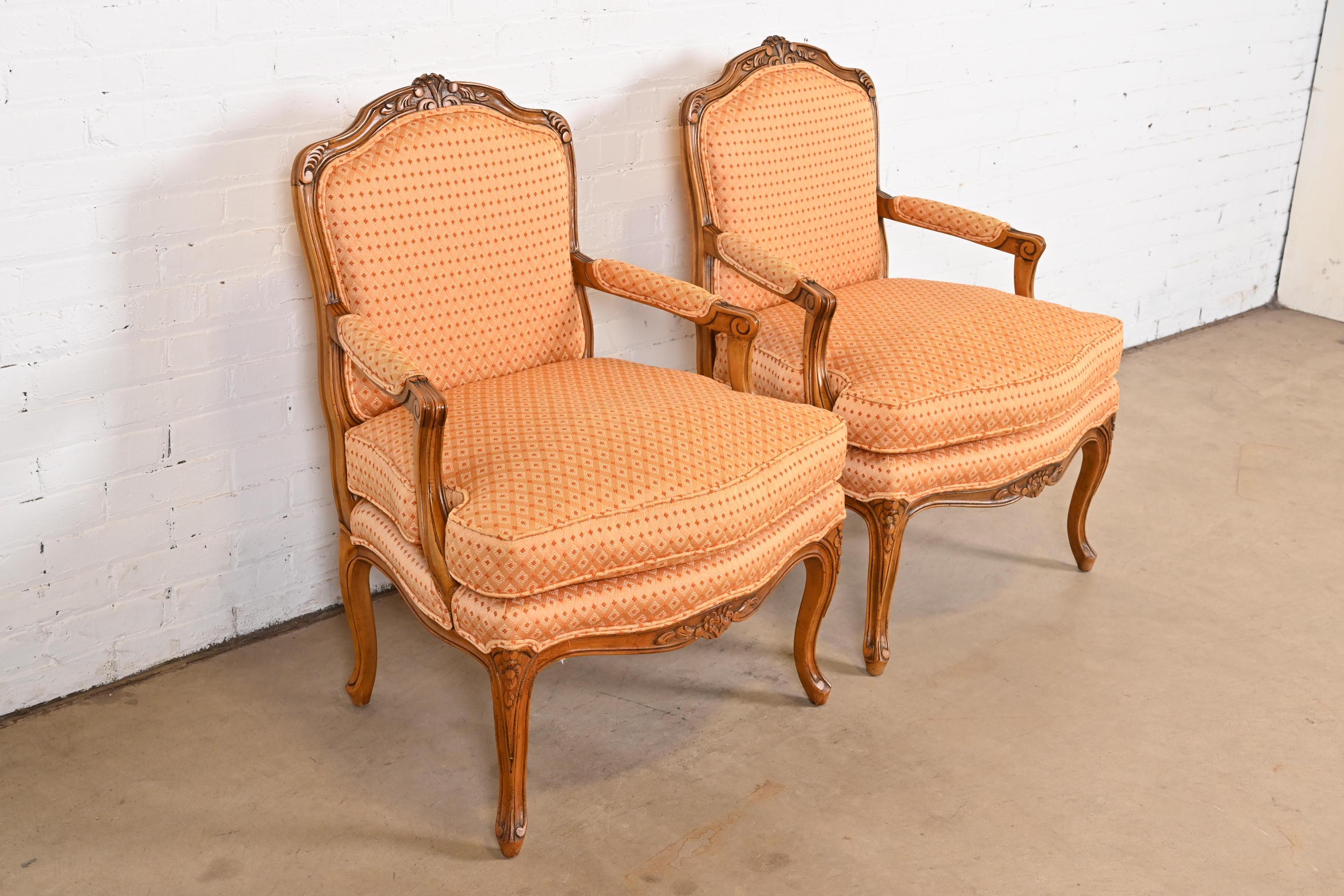 Late 20th Century Baker Furniture French Provincial Louis XV Carved Walnut Fauteuils, Pair