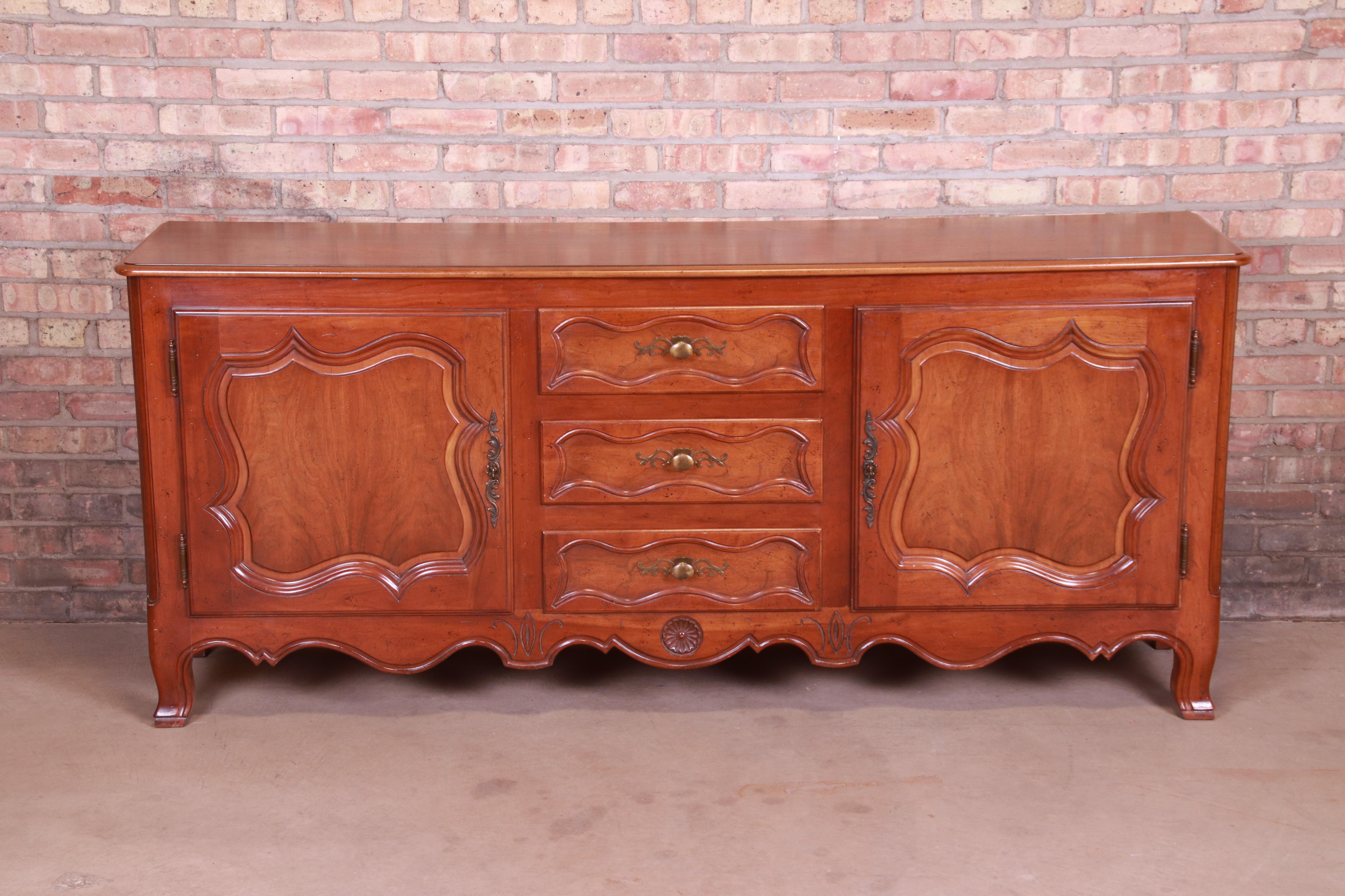 An exceptional French Provincial Louis XV style sideboard, credenza, or bar cabinet

By Baker Furniture 