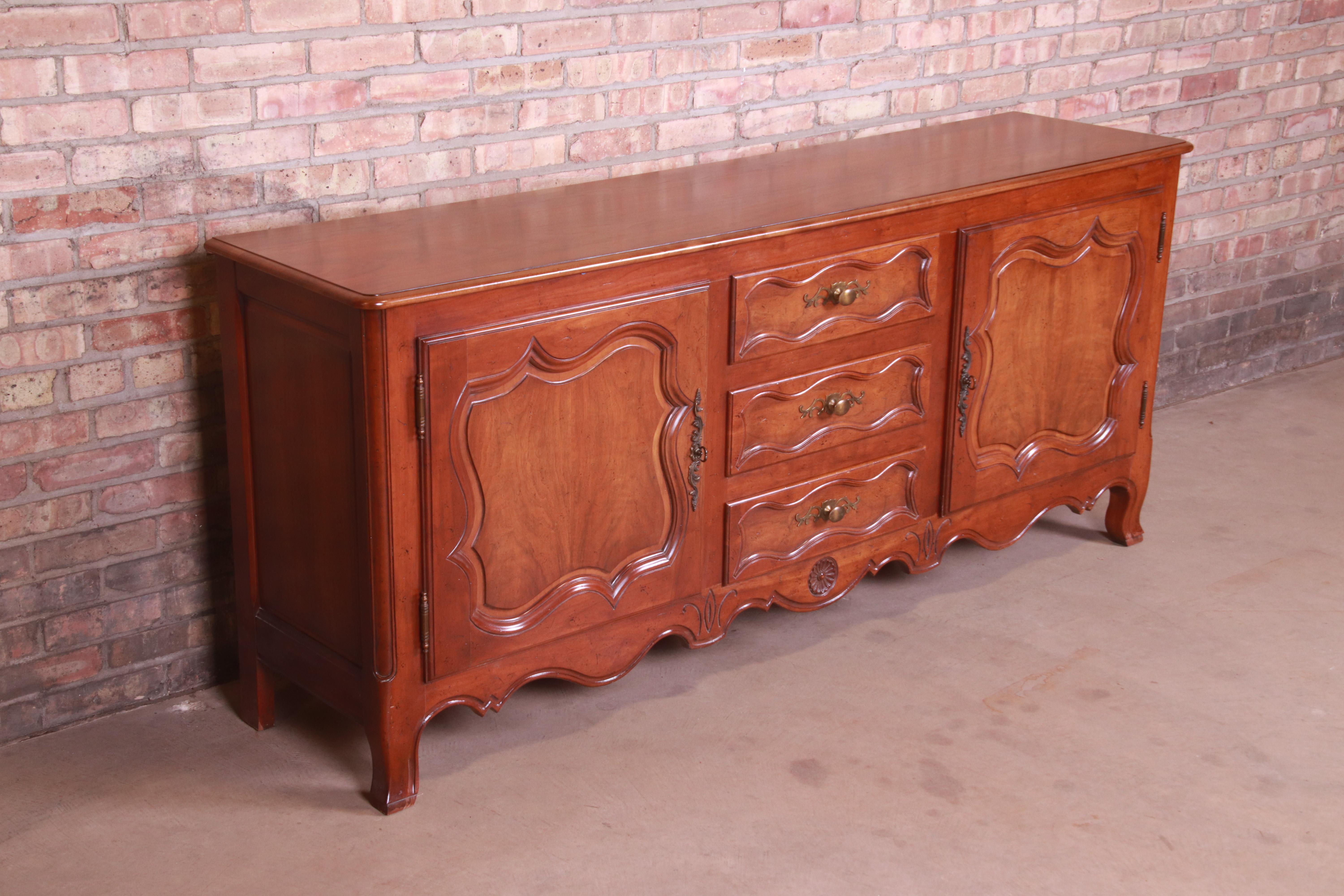 American Baker Furniture French Provincial Louis XV Carved Walnut Sideboard, circa 1960s For Sale