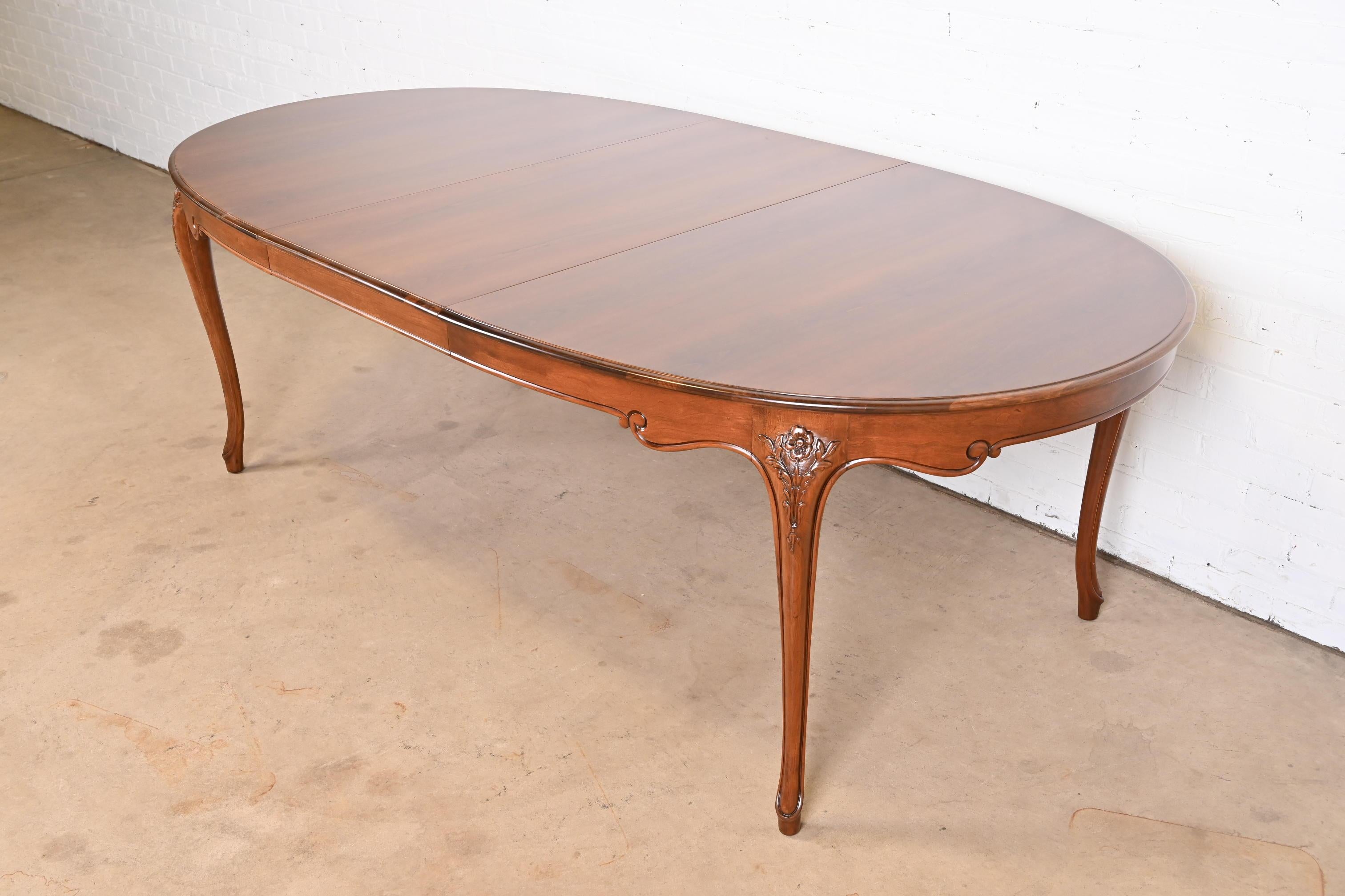 An exceptional French Provincial Louis XV style extension dining table

By Baker Furniture

USA, Circa 1960s

Gorgeous book-matched cherry wood, with carved solid cherry wood cabriole legs.

Measures: 67