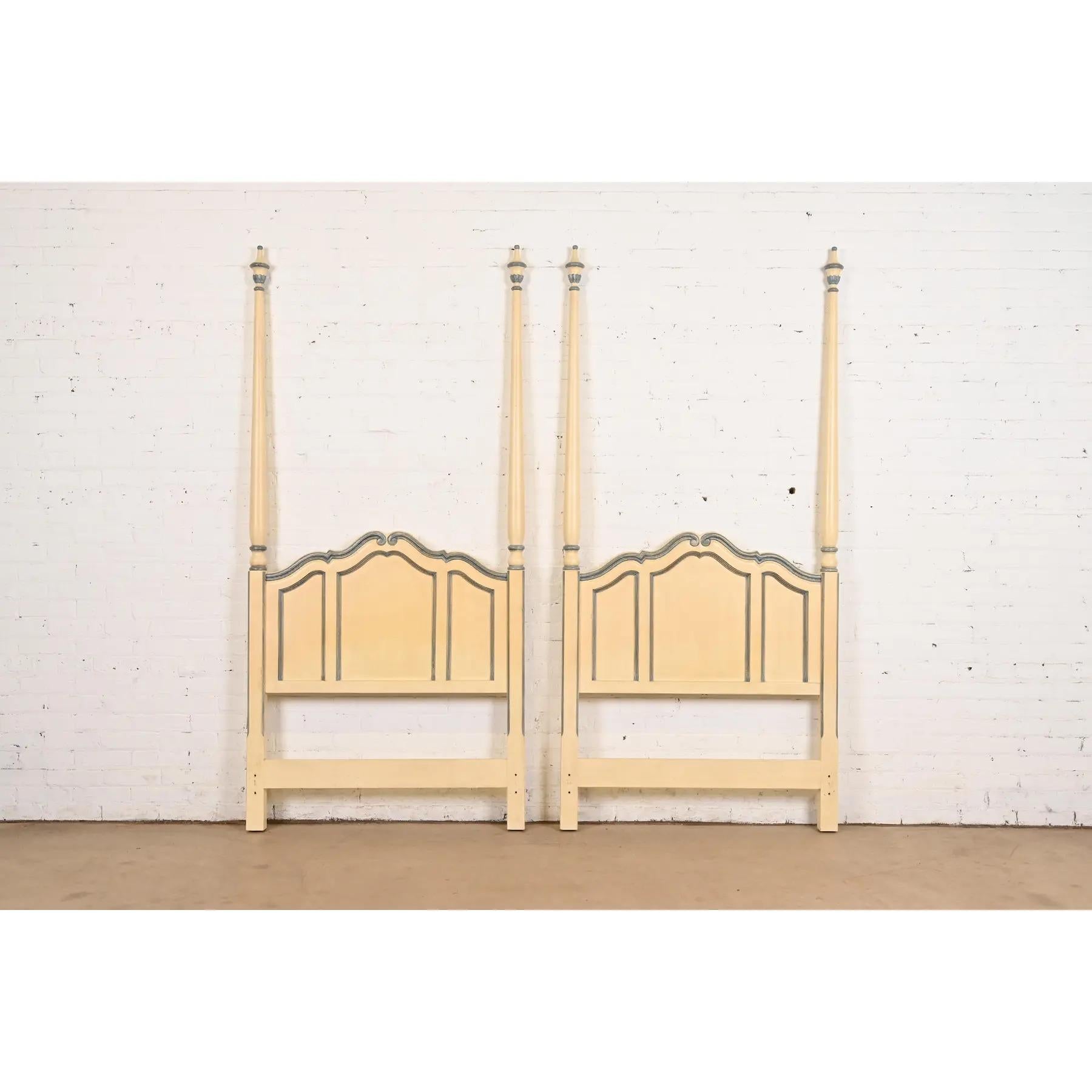 A gorgeous pair of French Rococo or French Provincial Louis XV style twin size poster headboards

By Baker Furniture

USA, Circa 1960s

Solid carved cherry wood, with original cream lacquered finish with blue gray trim.

Each measures: 39.5