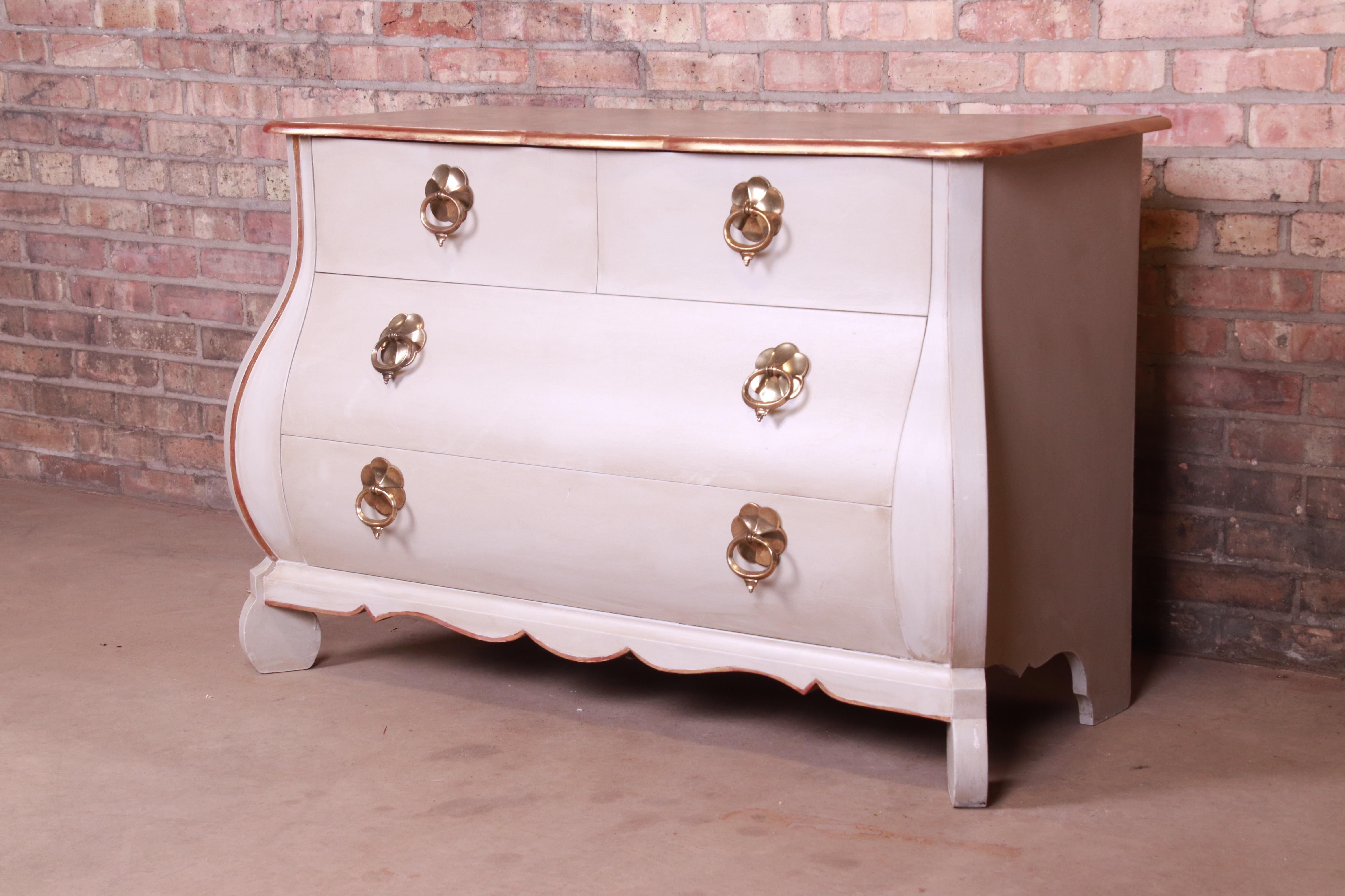 A gorgeous French Provincial Louis XV style Bombay chest or commode

By Baker Furniture

USA, circa 1960s

Painted walnut, with faux painted marble top, and original brass hardware.

Measures: 47