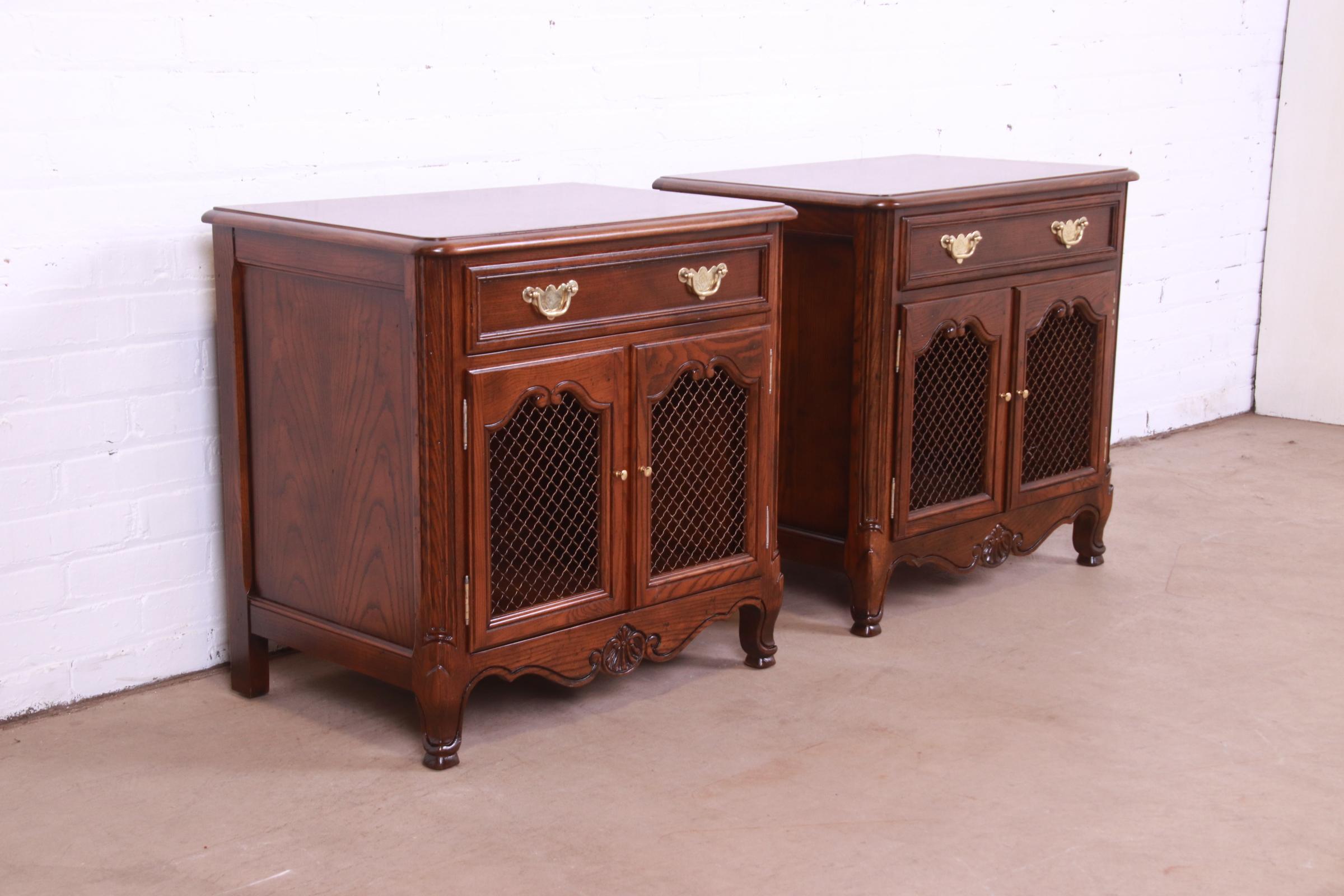 A gorgeous pair of French Provincial Louis XV style nightstands or end tables

By Baker Furniture, 