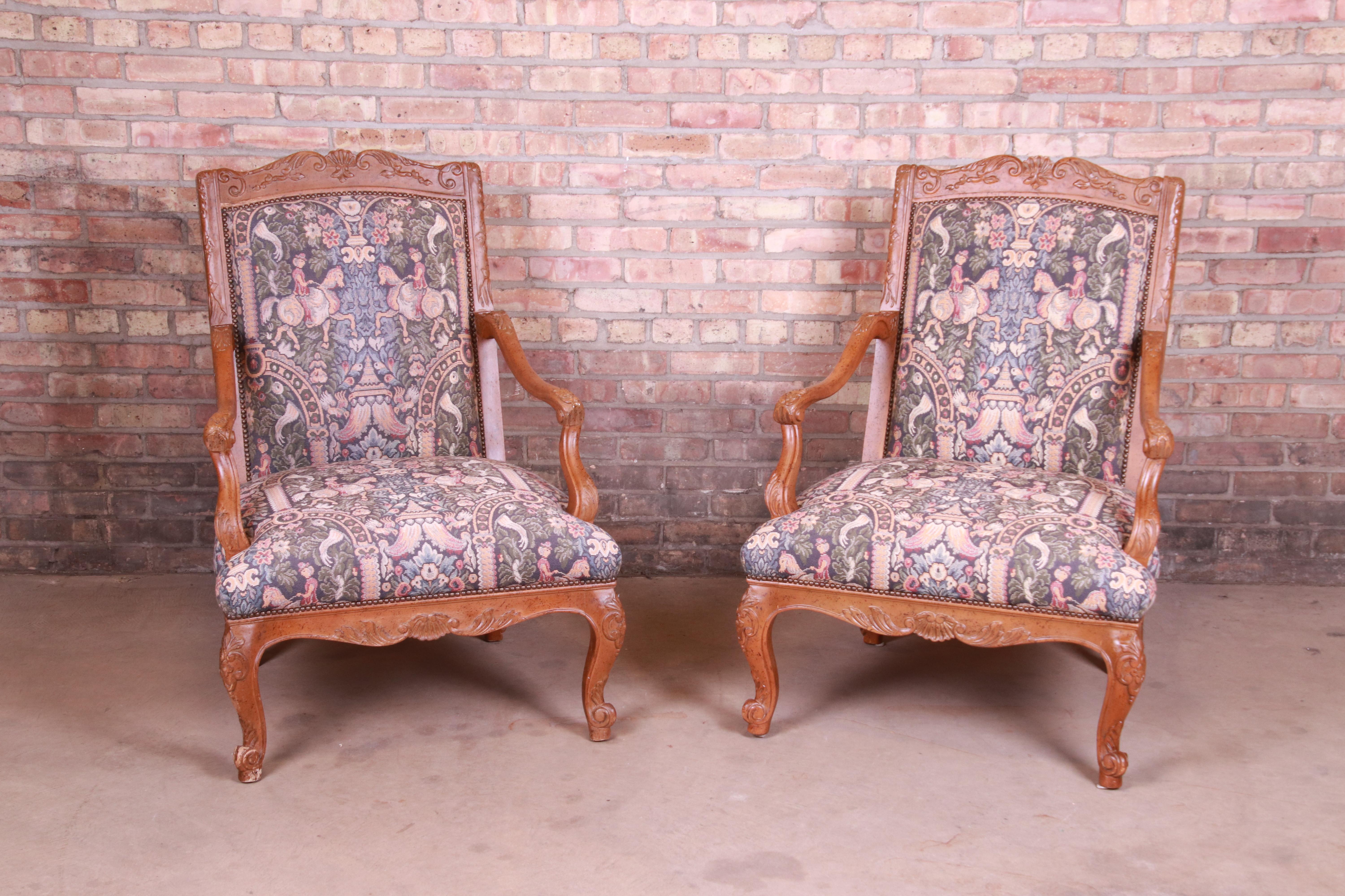 An exceptional pair of French Provincial Louis XV style fauteuils

By Baker Furniture,

USA, circa 1980s

Carved solid wood frames, with horse and rider motif tapestry upholstery.

Measures: 29