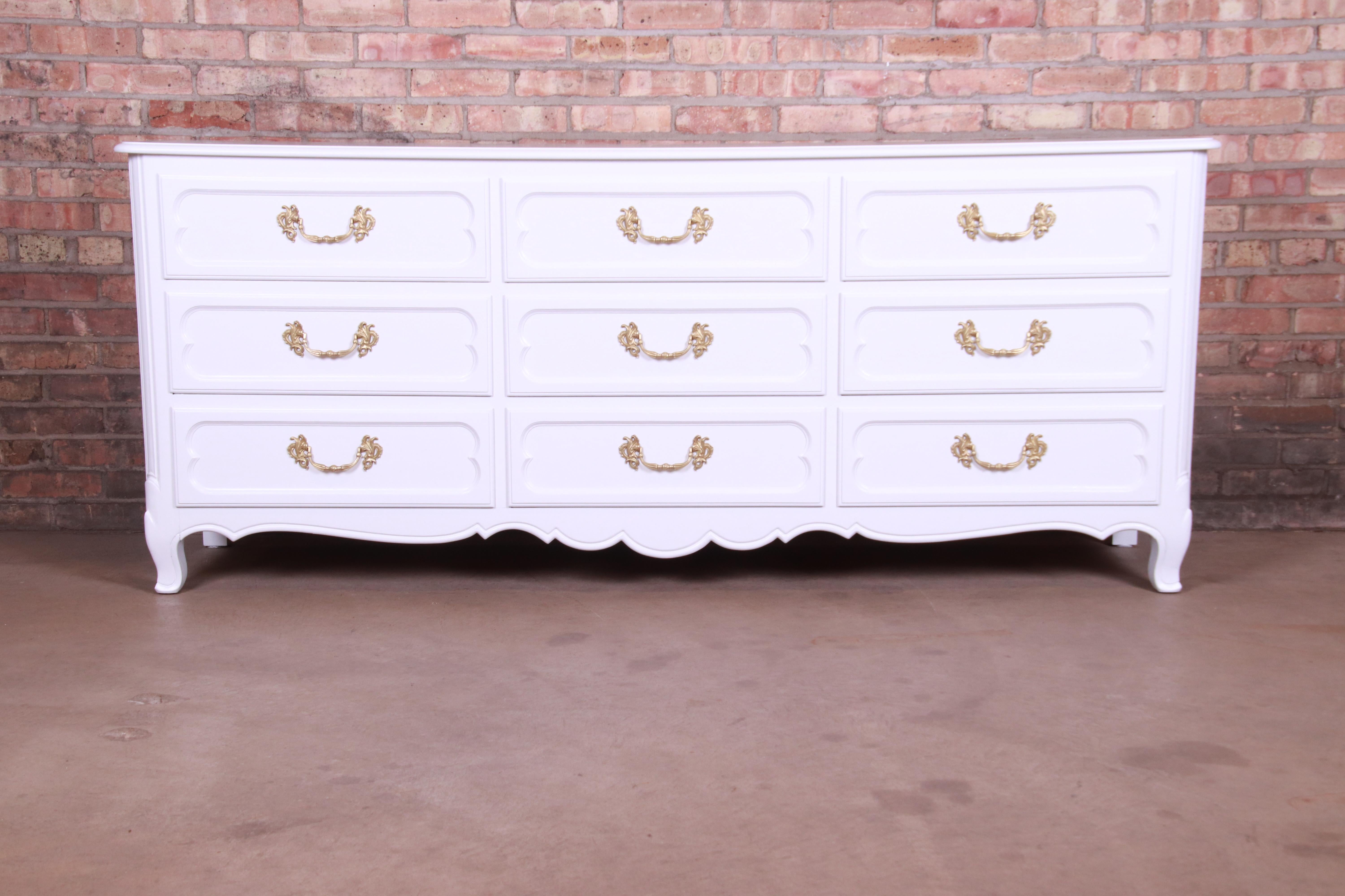 A gorgeous French Provincial Louis XV style triple dresser or credenza

By Baker Furniture 