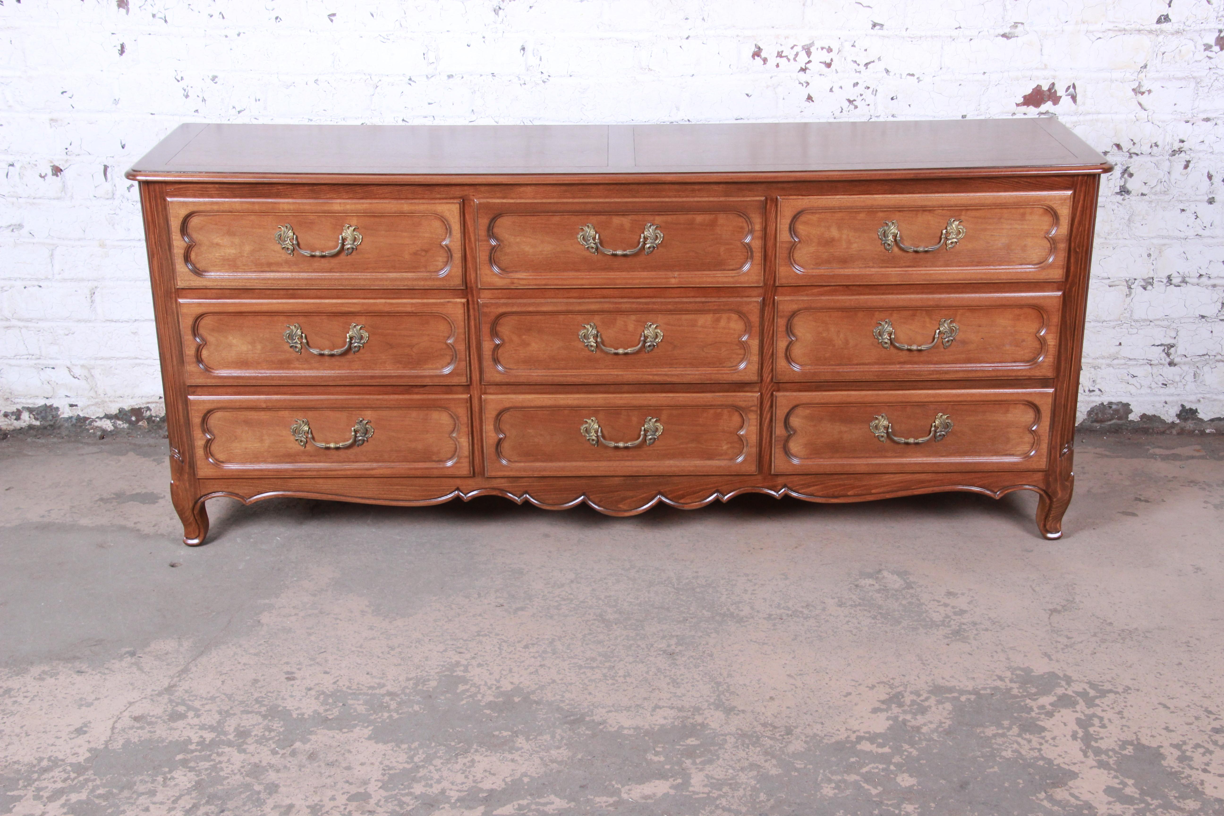 An exceptional French Provincial Louis XV style long dresser or credenza

By Baker Furniture 