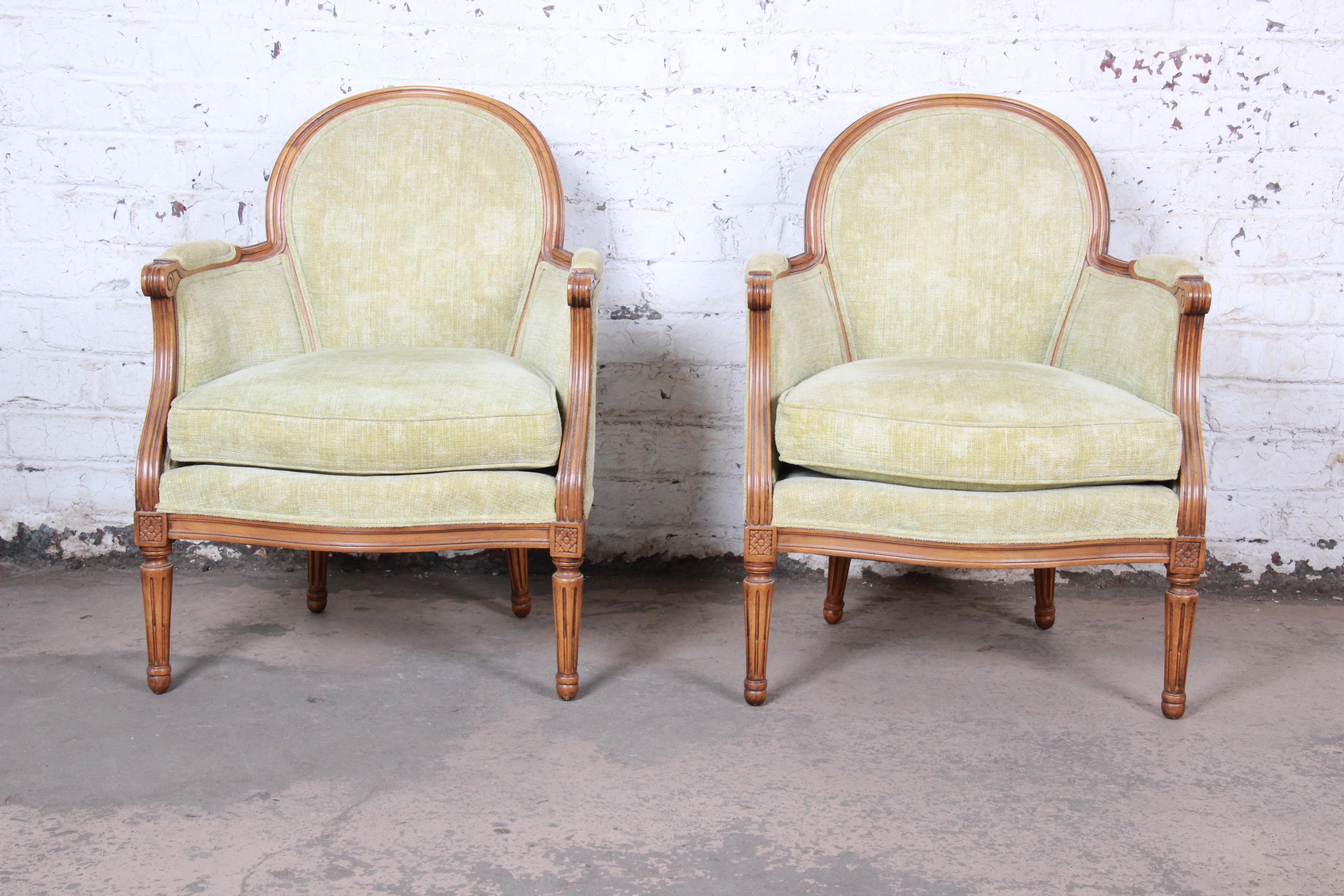 A gorgeous pair of French Provincial Louis XVI style fauteuils

By Baker Furniture

USA, circa 1960s

Fruitwood and upholstery

Measures: 26