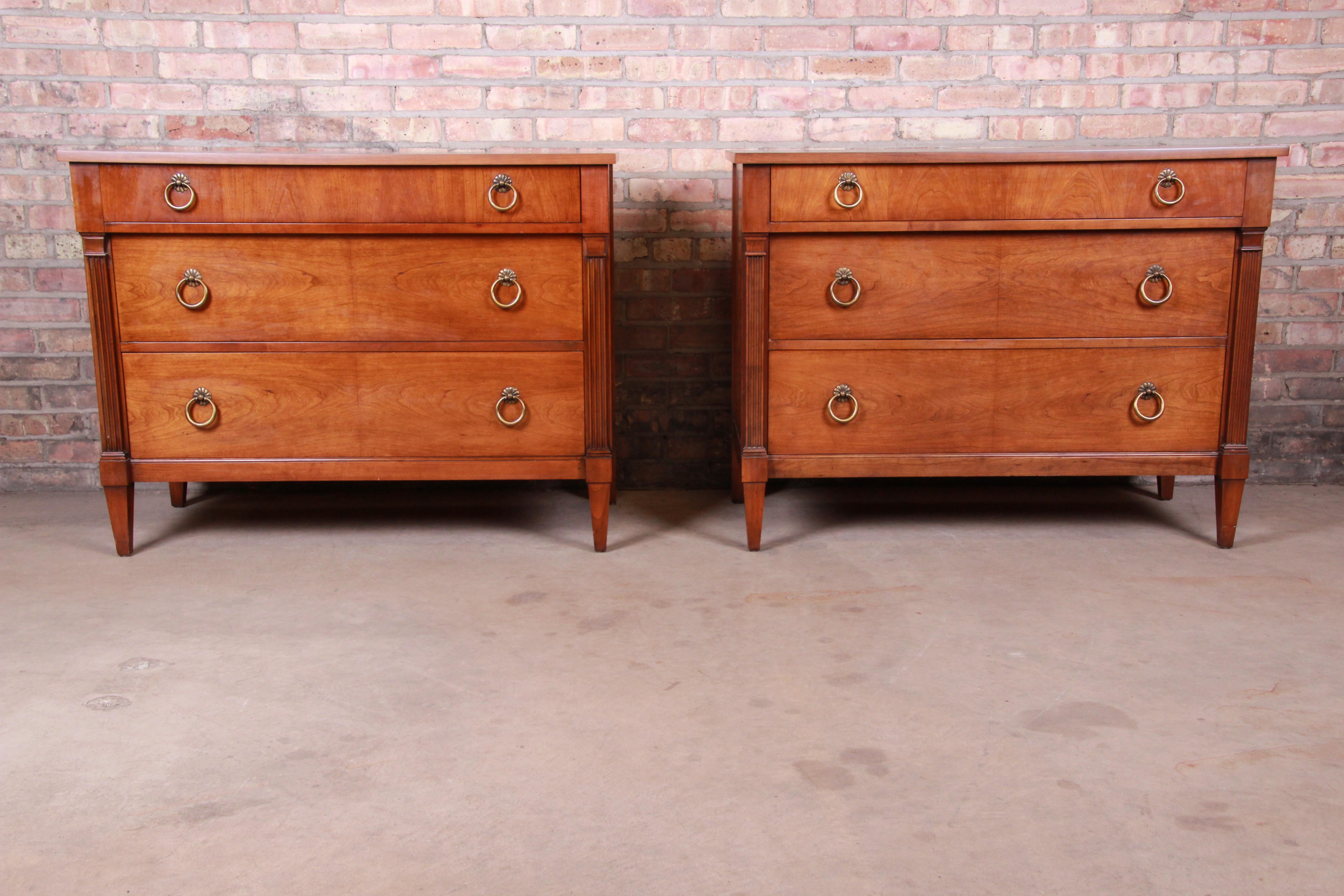 A gorgeous pair of French Regency Louis XVI style three-drawer dressers or bedside chests

By Baker Furniture 