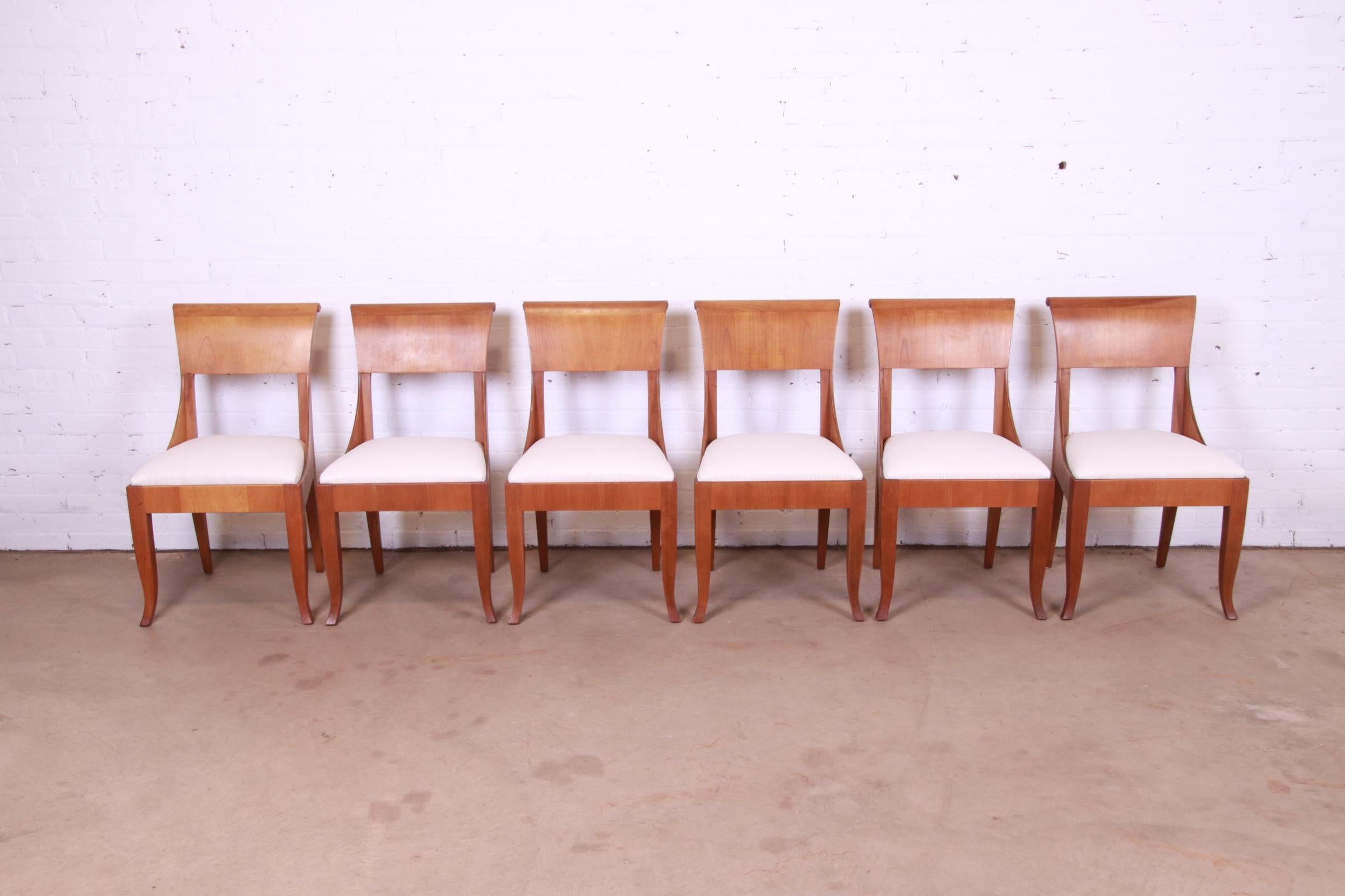 A gorgeous set of six French Regency style dining chairs

By Baker Furniture

USA, Circa 1950s

Cherry wood frames, with upholstered seats in a textured white designer fabric.

Measures: 19.75