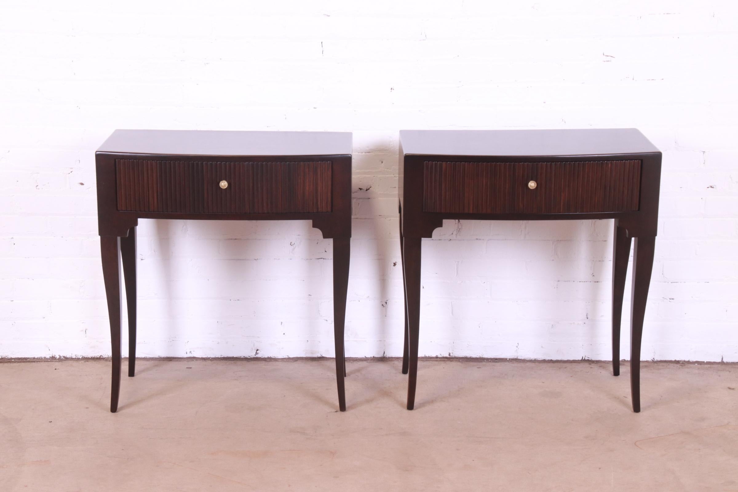 A gorgeous pair of French Regency Louis XV style single drawer nightstands or end tables

By Baker Furniture

USA, Mid-20th Century

Mahogany, with brass hardware.

Measures: 28