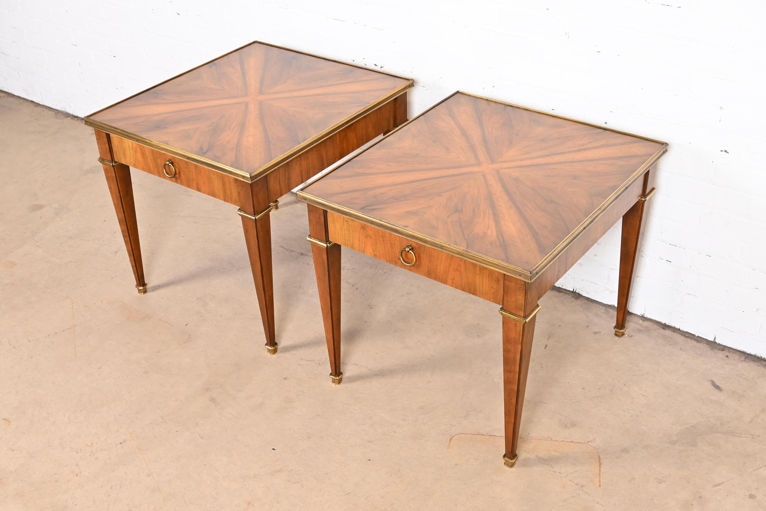 A gorgeous pair of French Regency Louis XVI style nightstands, tea tables, or end tables

By Baker Furniture

USA, circa 1960s

Cherry wood, with stunning book-matched burled walnut tops, and brass hardware and accents.

Measures: 24.25