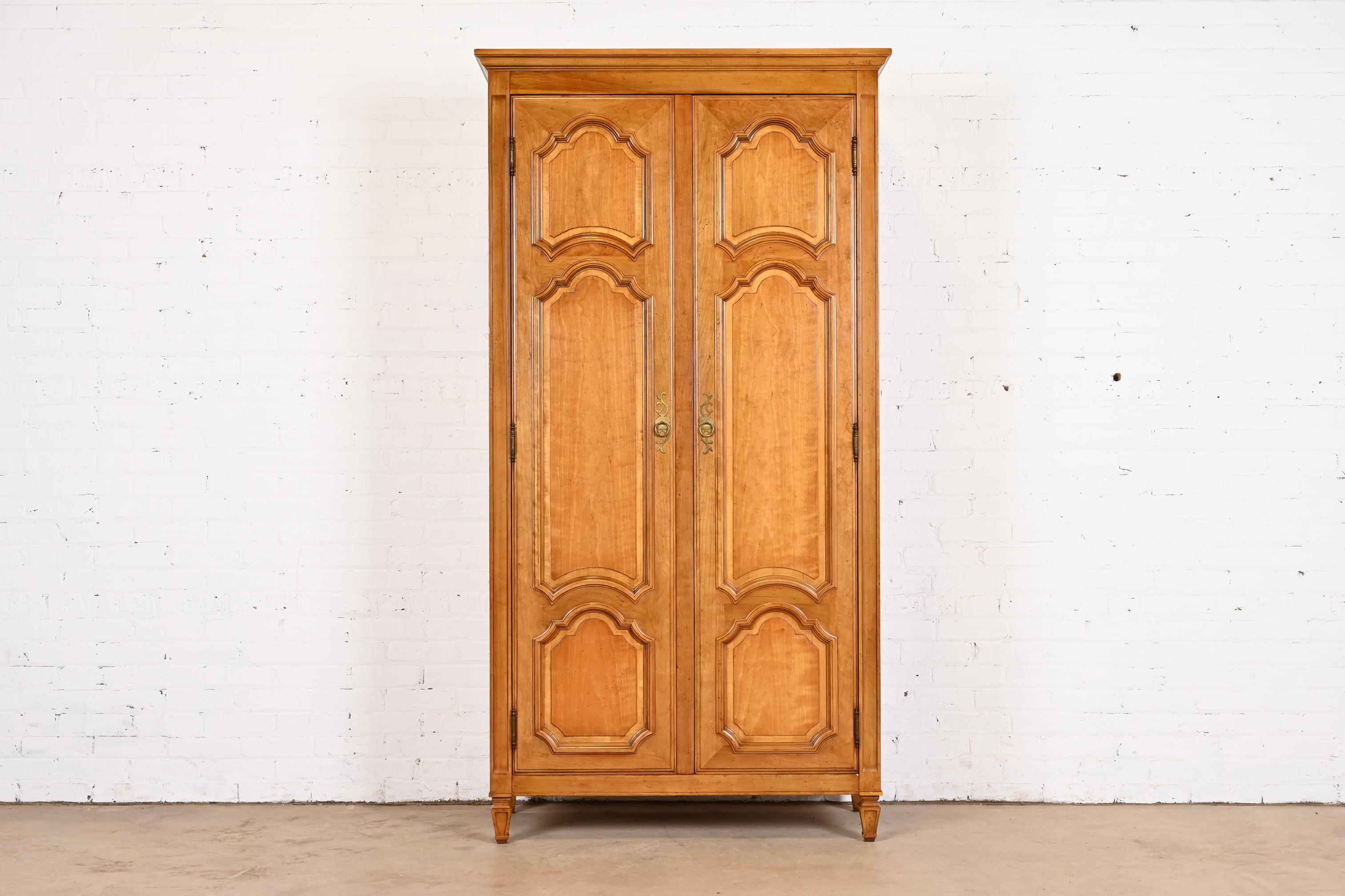 A gorgeous French Regency Louis XVI style armoire dresser or linen press

By Baker Furniture, 