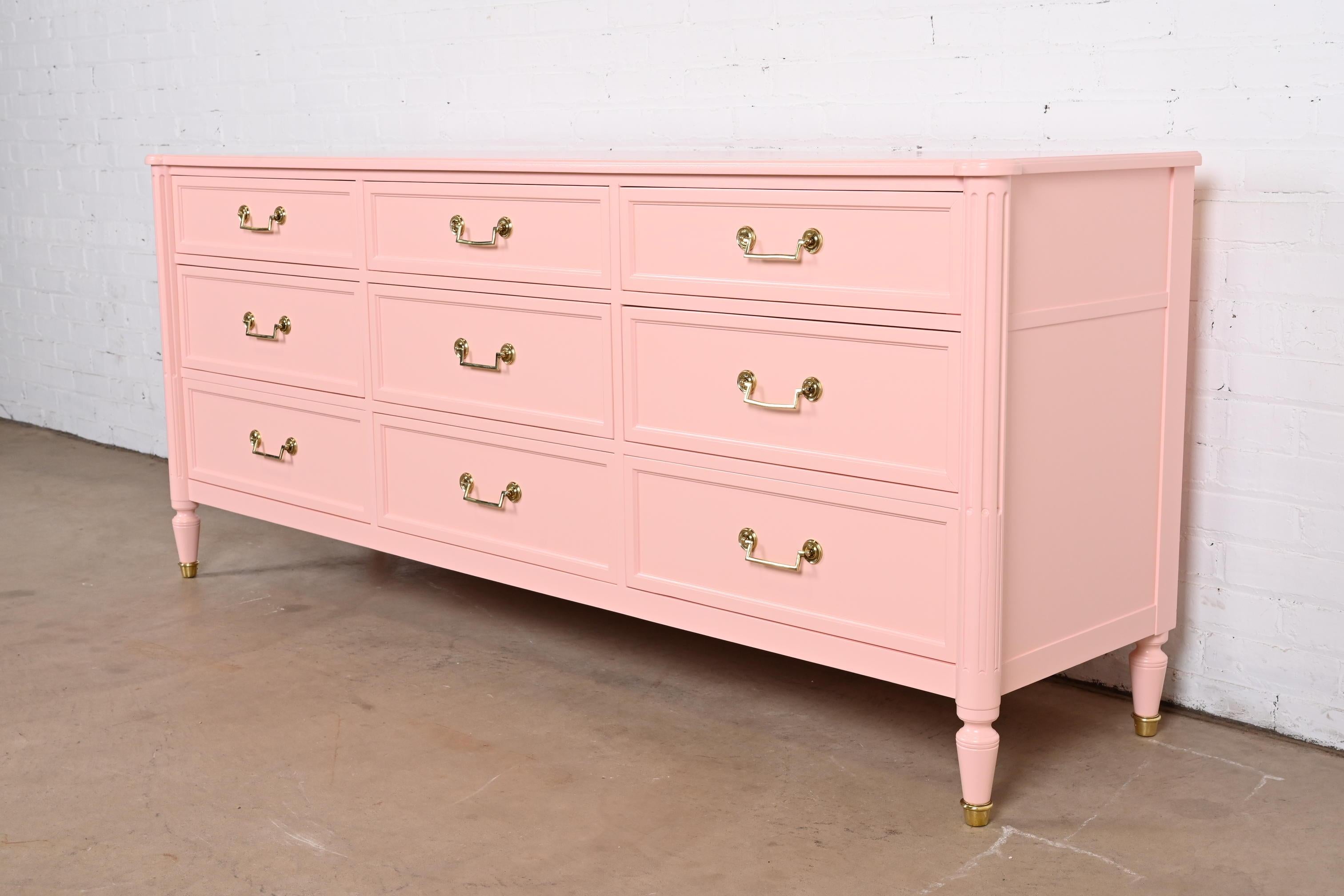 A gorgeous French Regency Louis XVI style nine-drawer triple dresser or credenza

By Baker Furniture, 