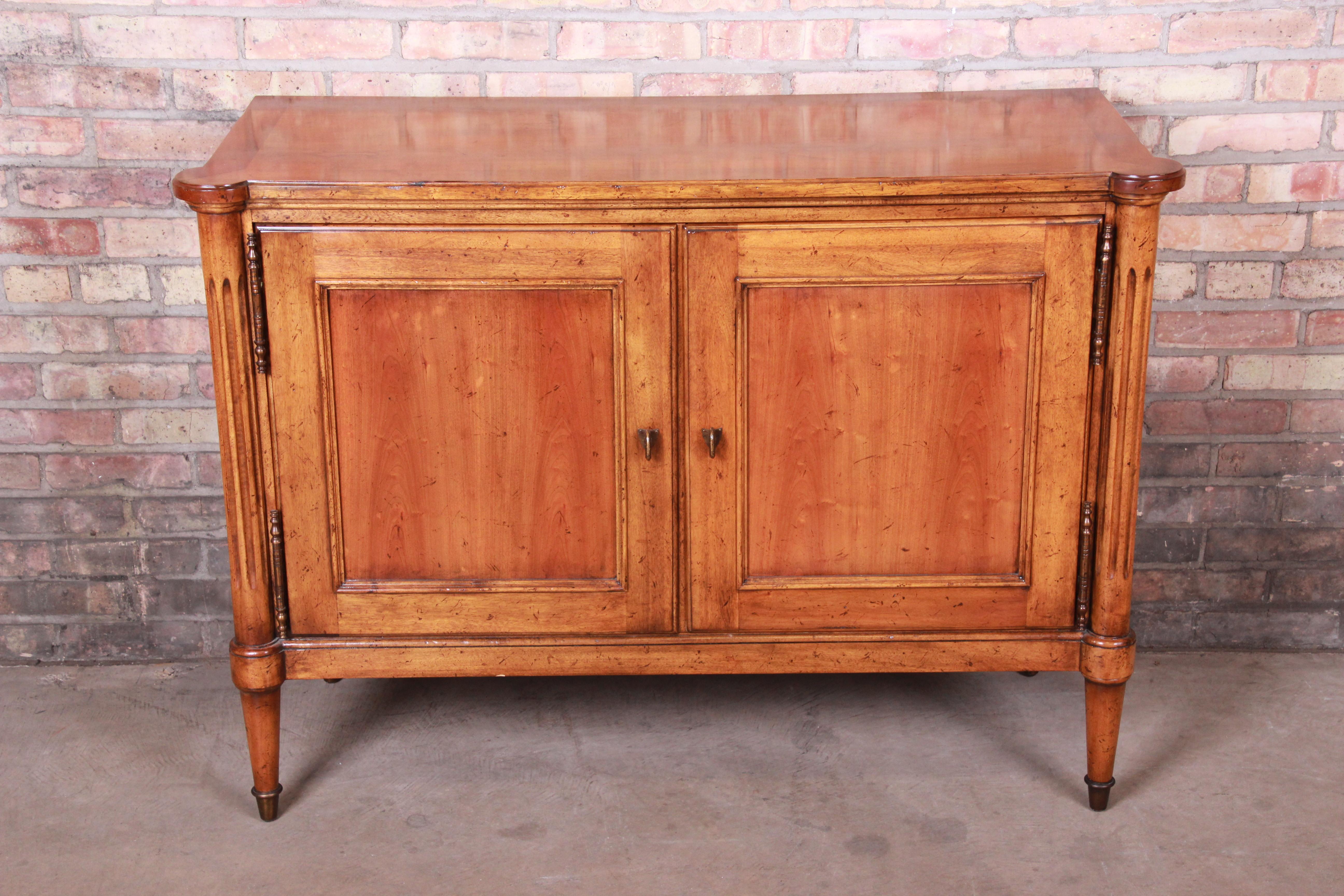 A gorgeous French Regency Louis XVI style credenza or bar cabinet

By Baker Furniture 