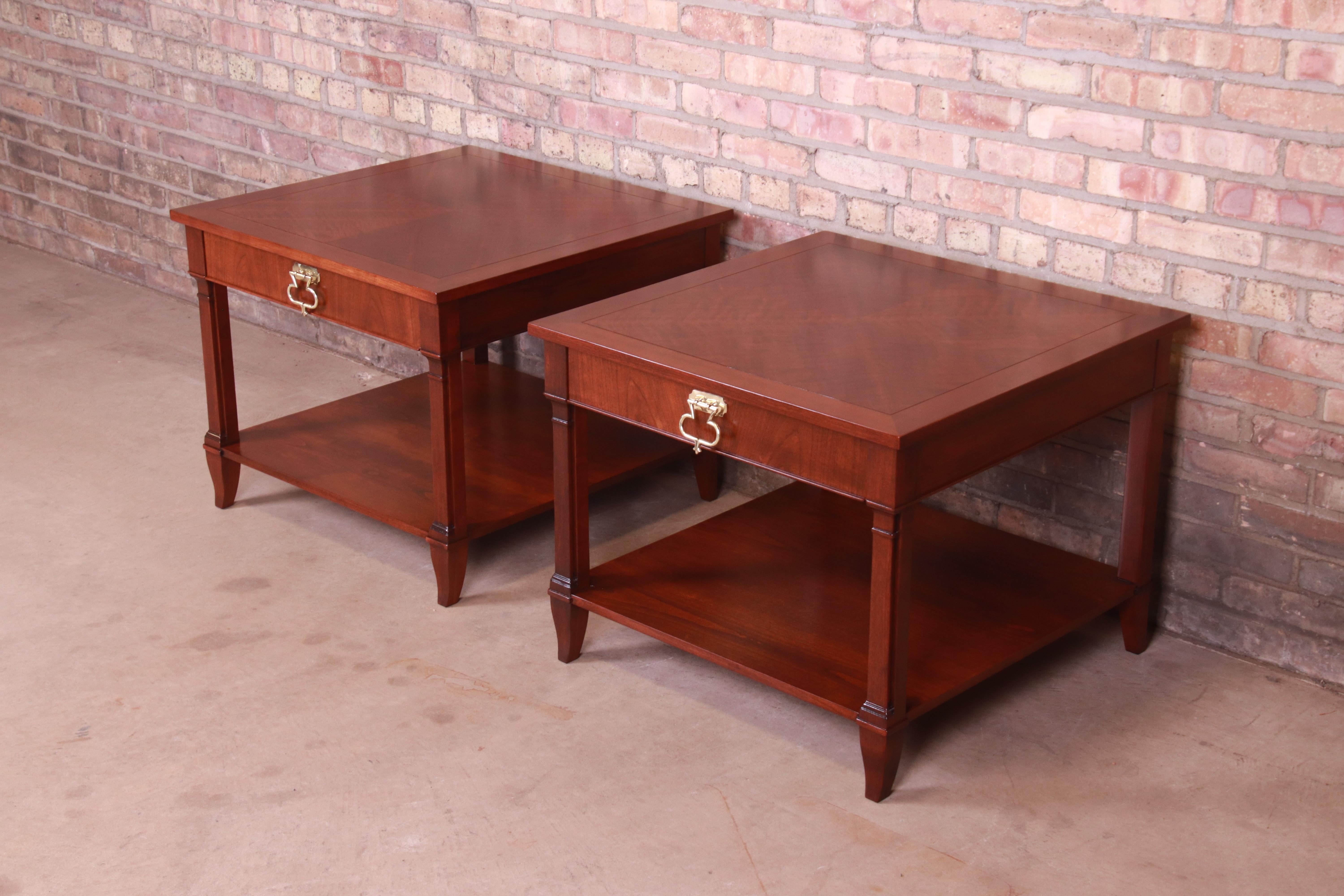 An exceptional pair of French Regency style end tables or nightstands

By Baker Furniture

USA, Circa 1960s

Carved mahogany, with original brass hardware.

Measures: 27.5