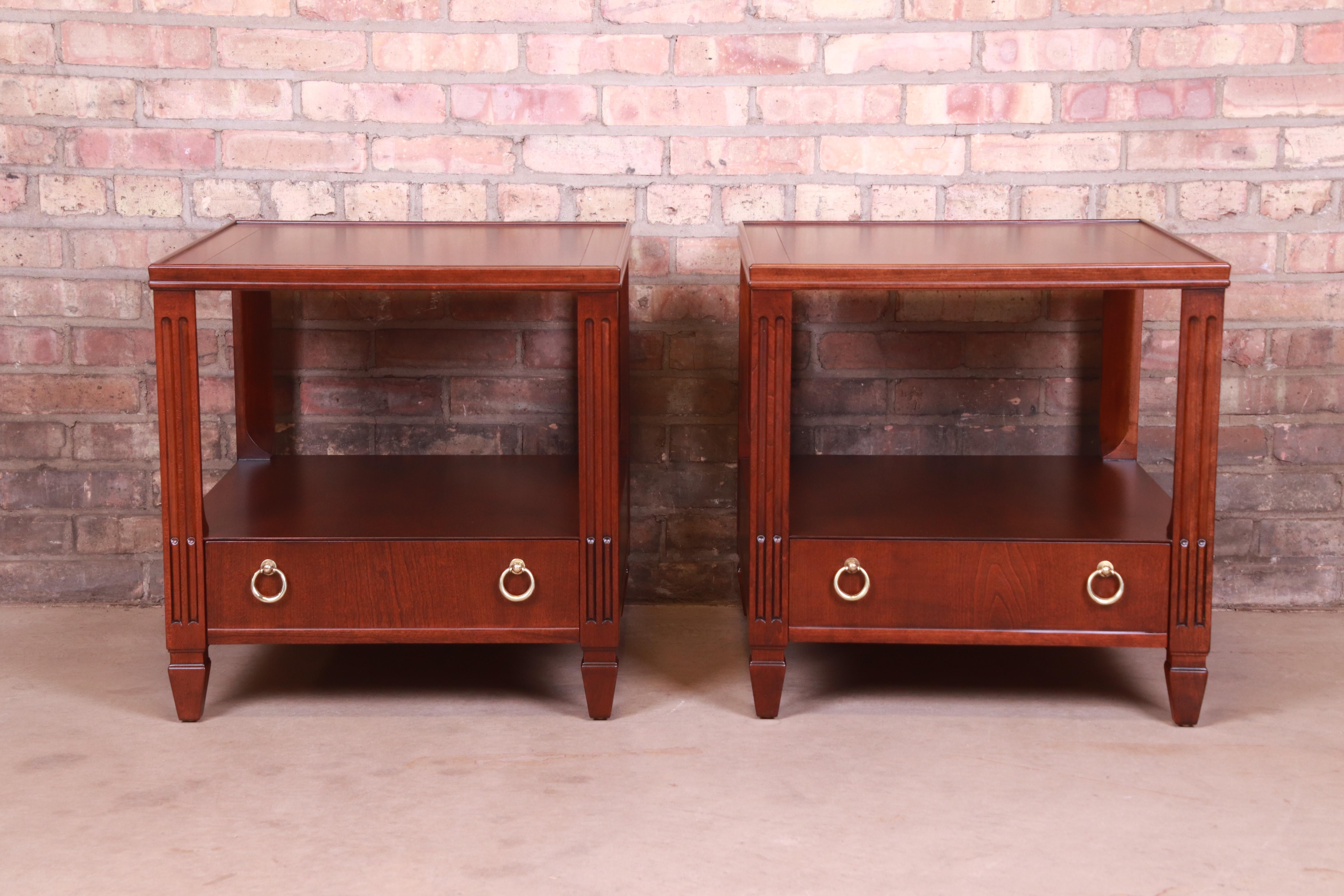 A gorgeous pair of mid-century French Regency style two-tier side tables or nightstands

By Baker Furniture

USA, Circa 1960s

Mahogany, with original brass hardware

Measures: 22