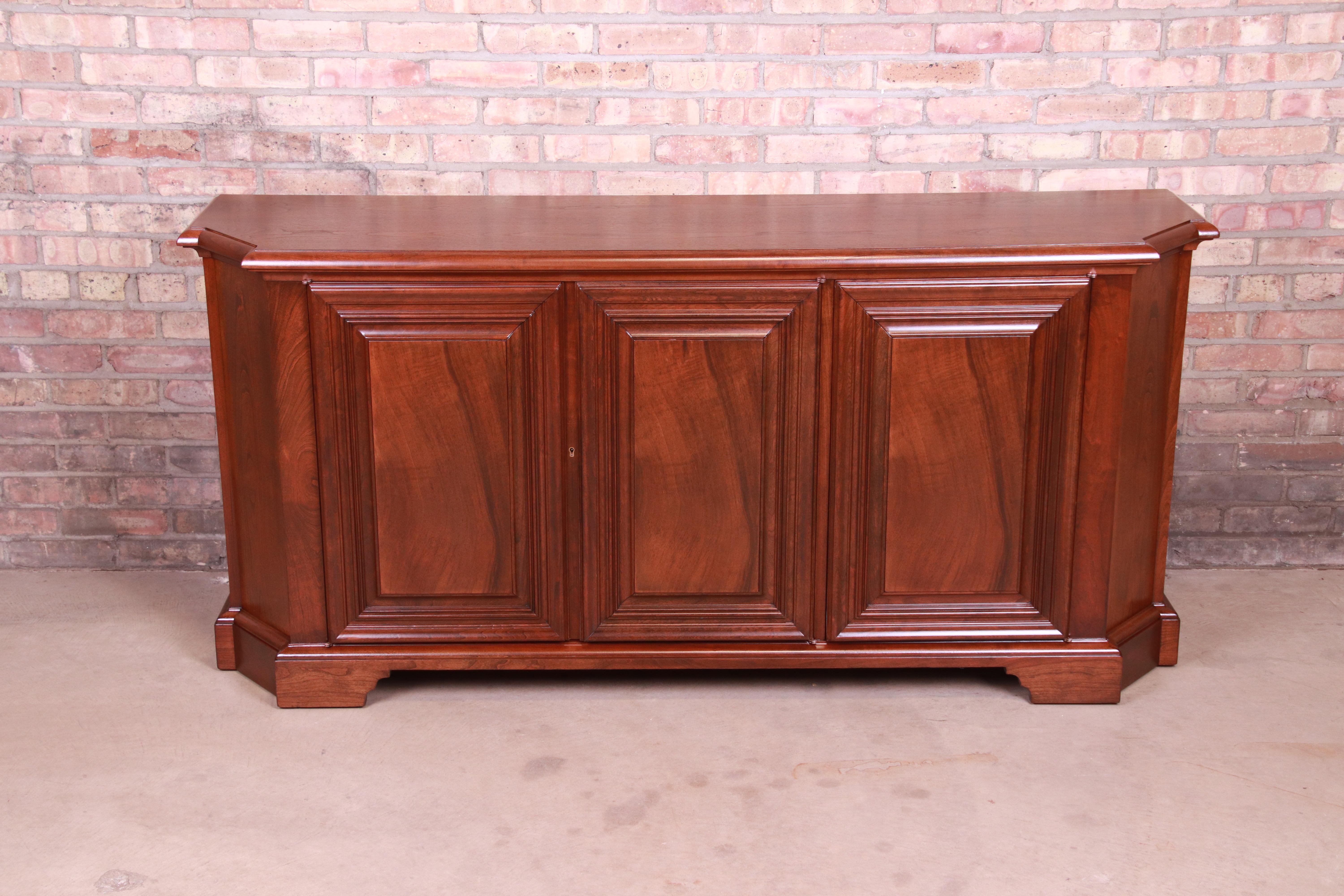 An exceptional French Regency style carved walnut sideboard, credenza, or bar cabinet

By Baker Furniture

USA, circa 1960s

Measures: 69