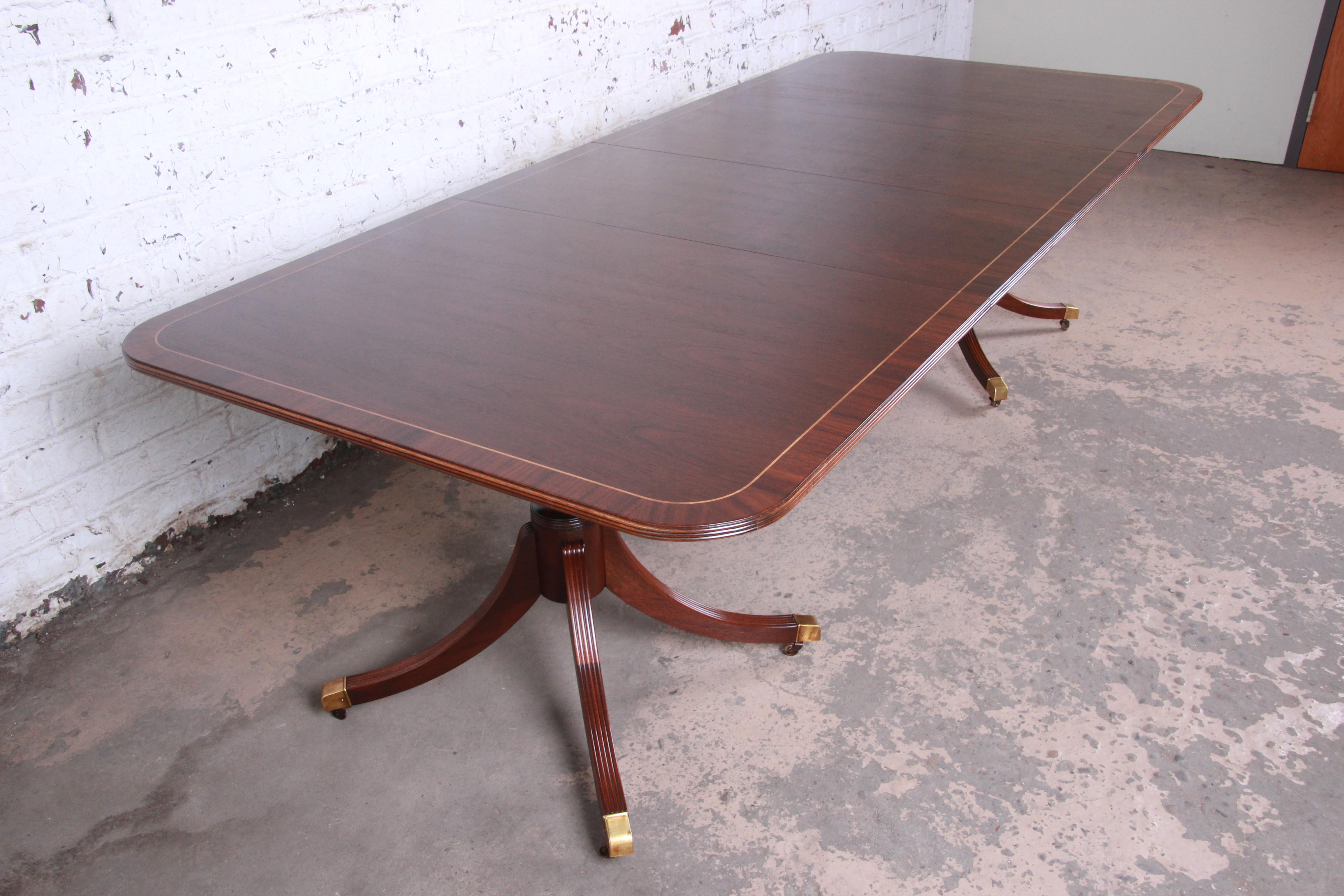 20th Century Baker Furniture Georgian Banded Mahogany Double Pedestal Dining Table, Restored