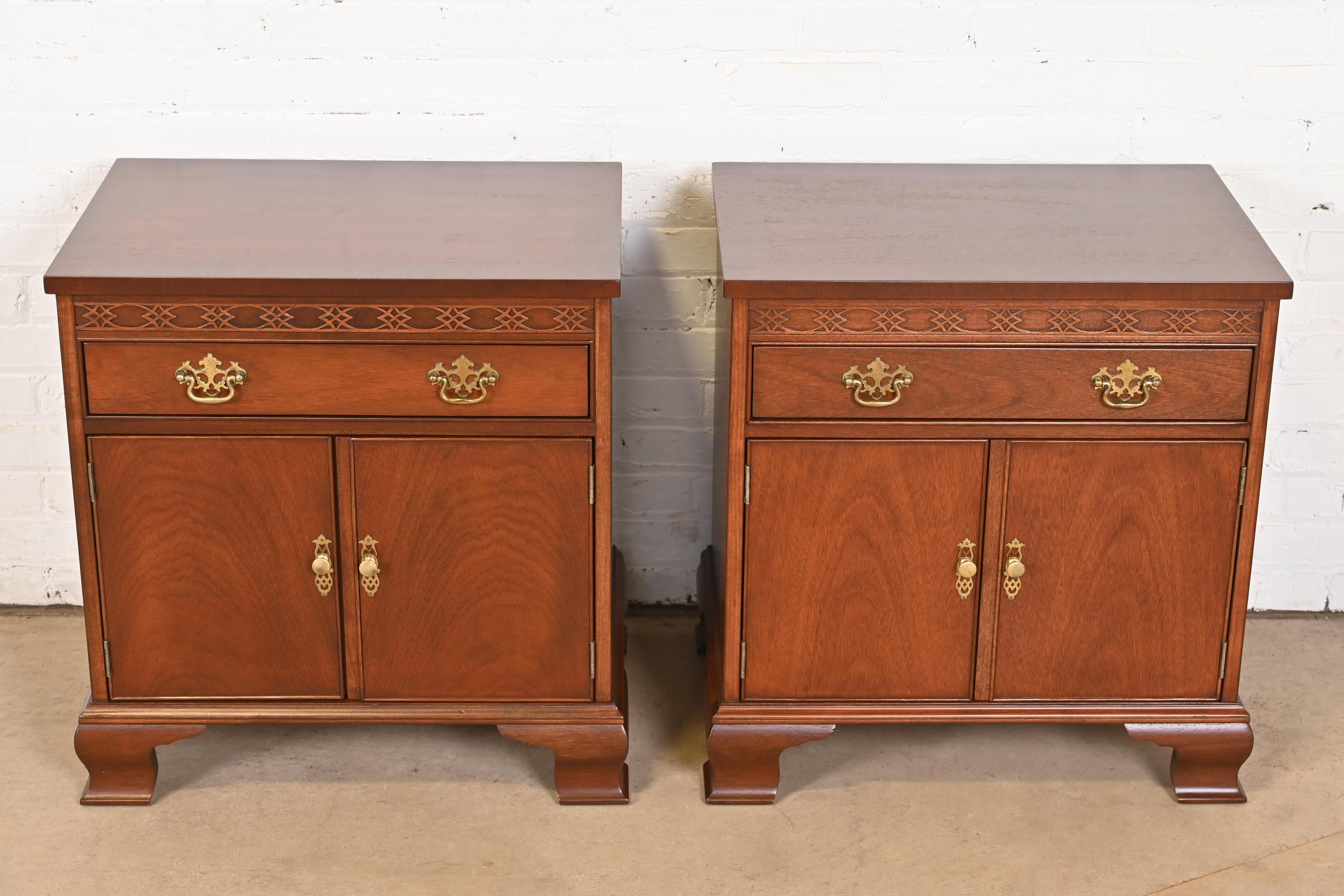 A gorgeous pair of Georgian or Chippendale style bedside chests or end tables

By Baker Furniture

USA, Circa 1980s

Carved mahogany, with original brass hardware.

Measures: 24.75