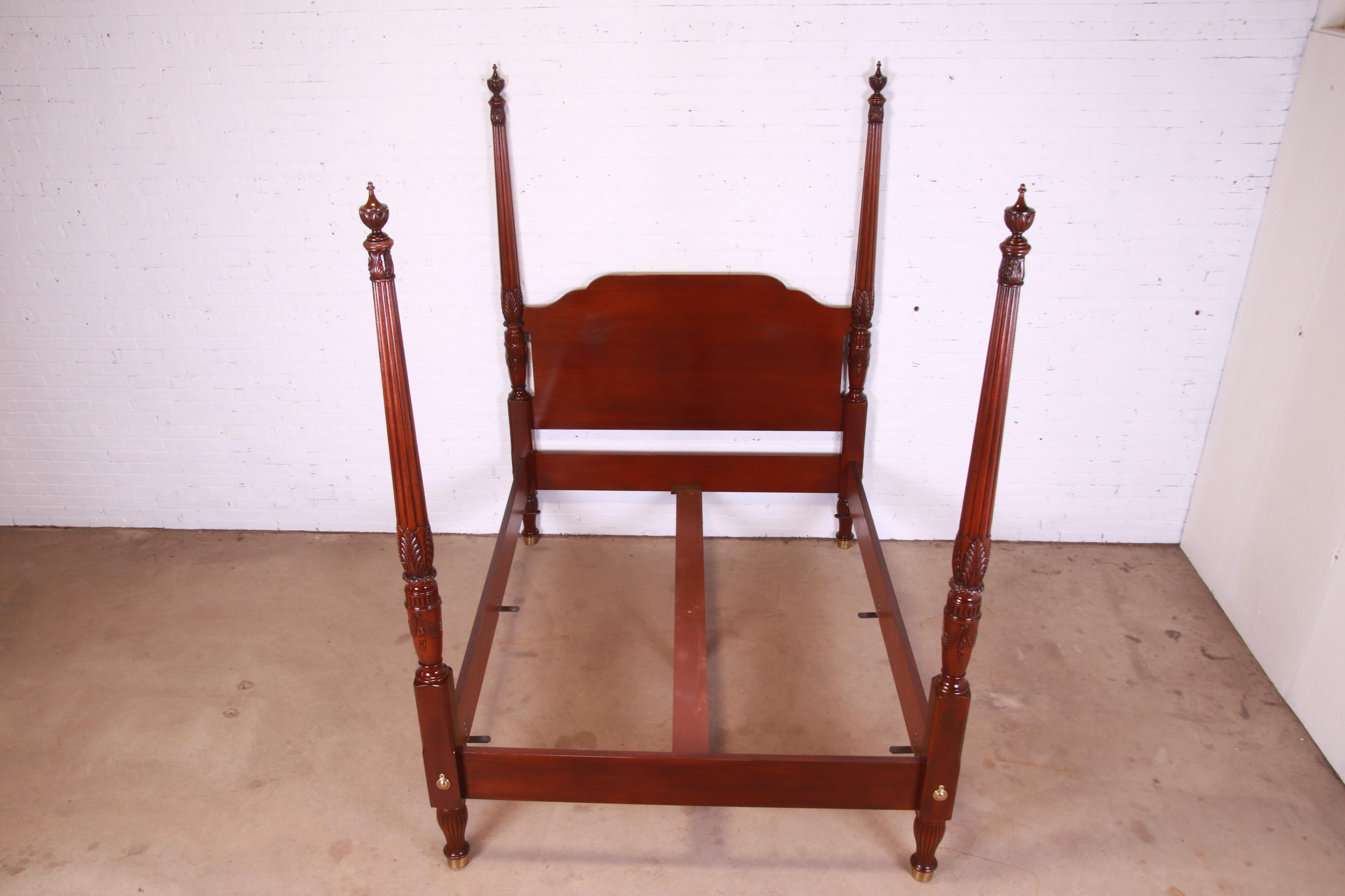A gorgeous Georgian or Chippendale style four-poster queen size bed.

By Baker Furniture, 