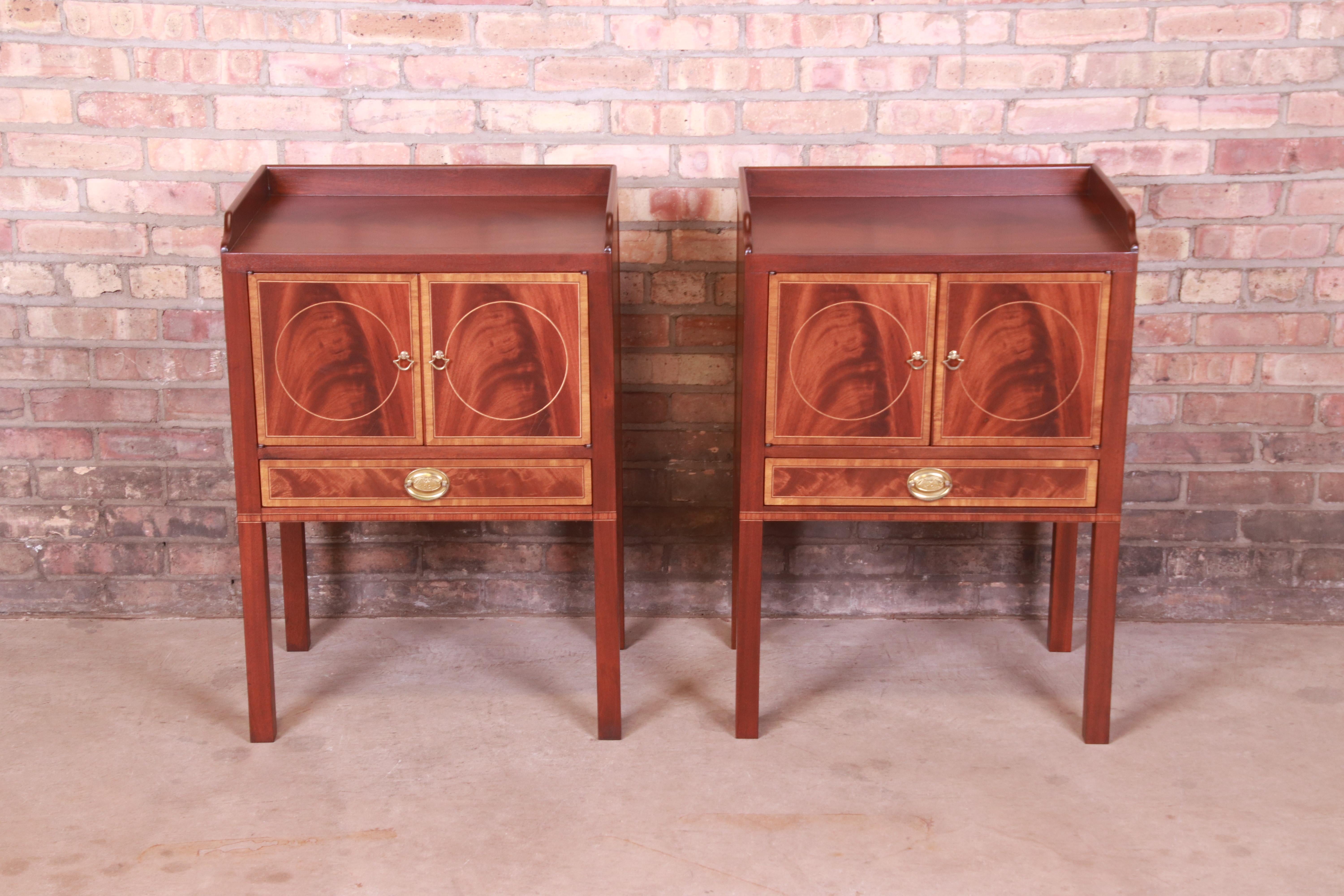 A gorgeous pair of Georgian or Federal style bedside tables

By Baker Furniture, 