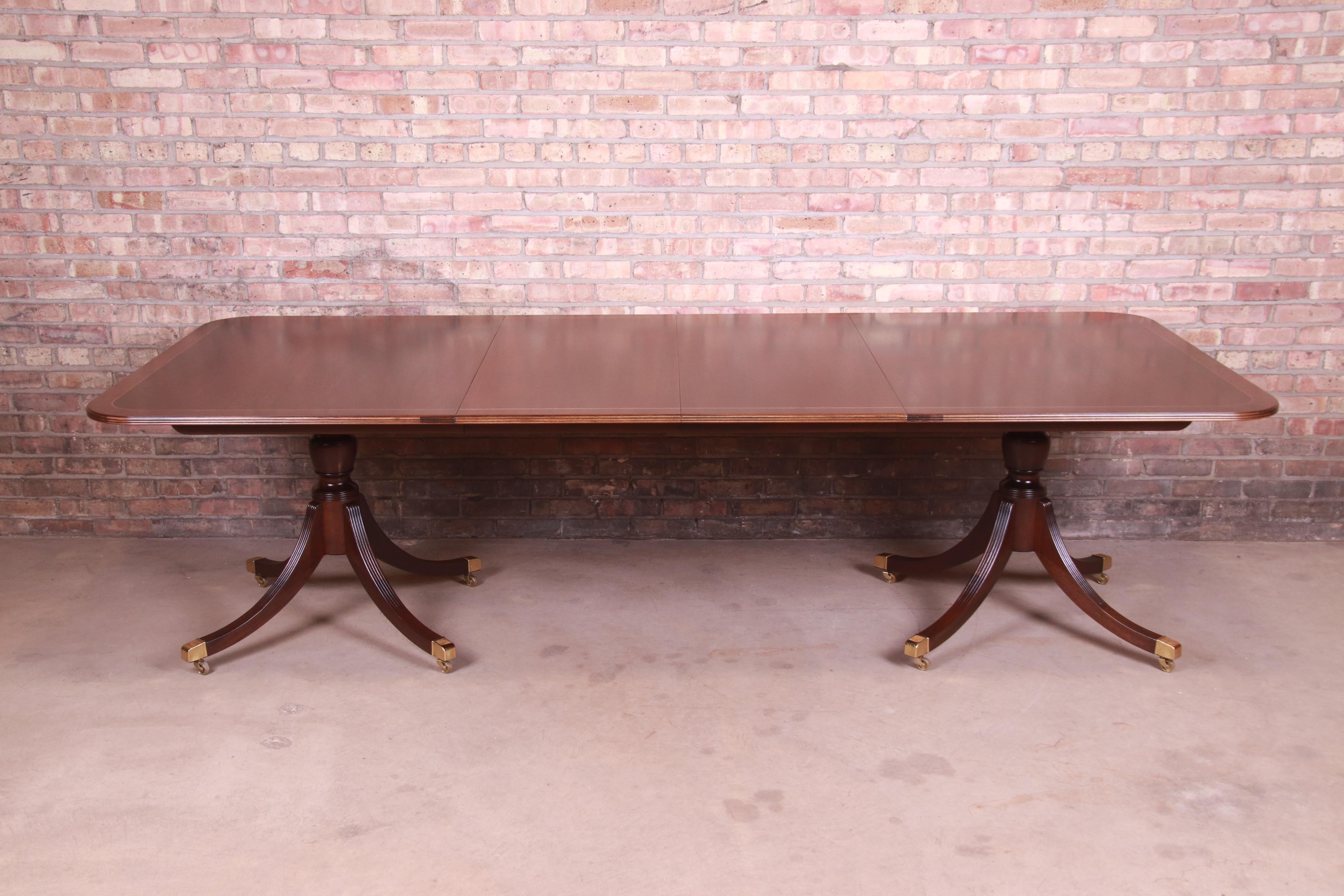 An exceptional Georgian style extension double pedestal dining table

By Baker Furniture 
