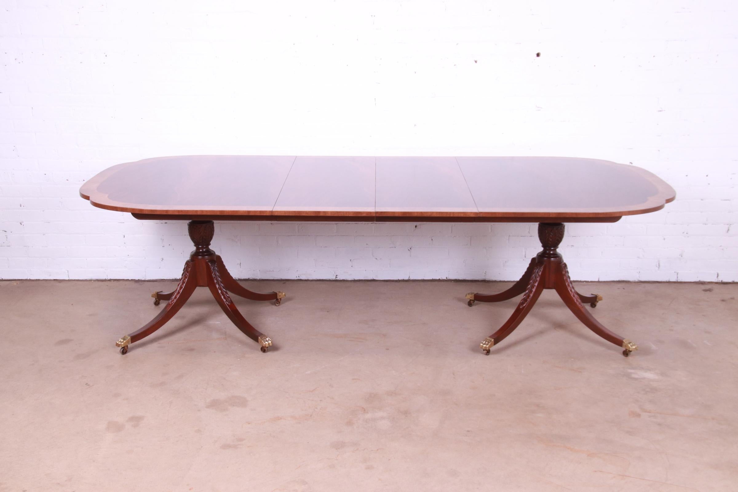 An exceptional Georgian style extension double pedestal dining table

By Baker Furniture, 
