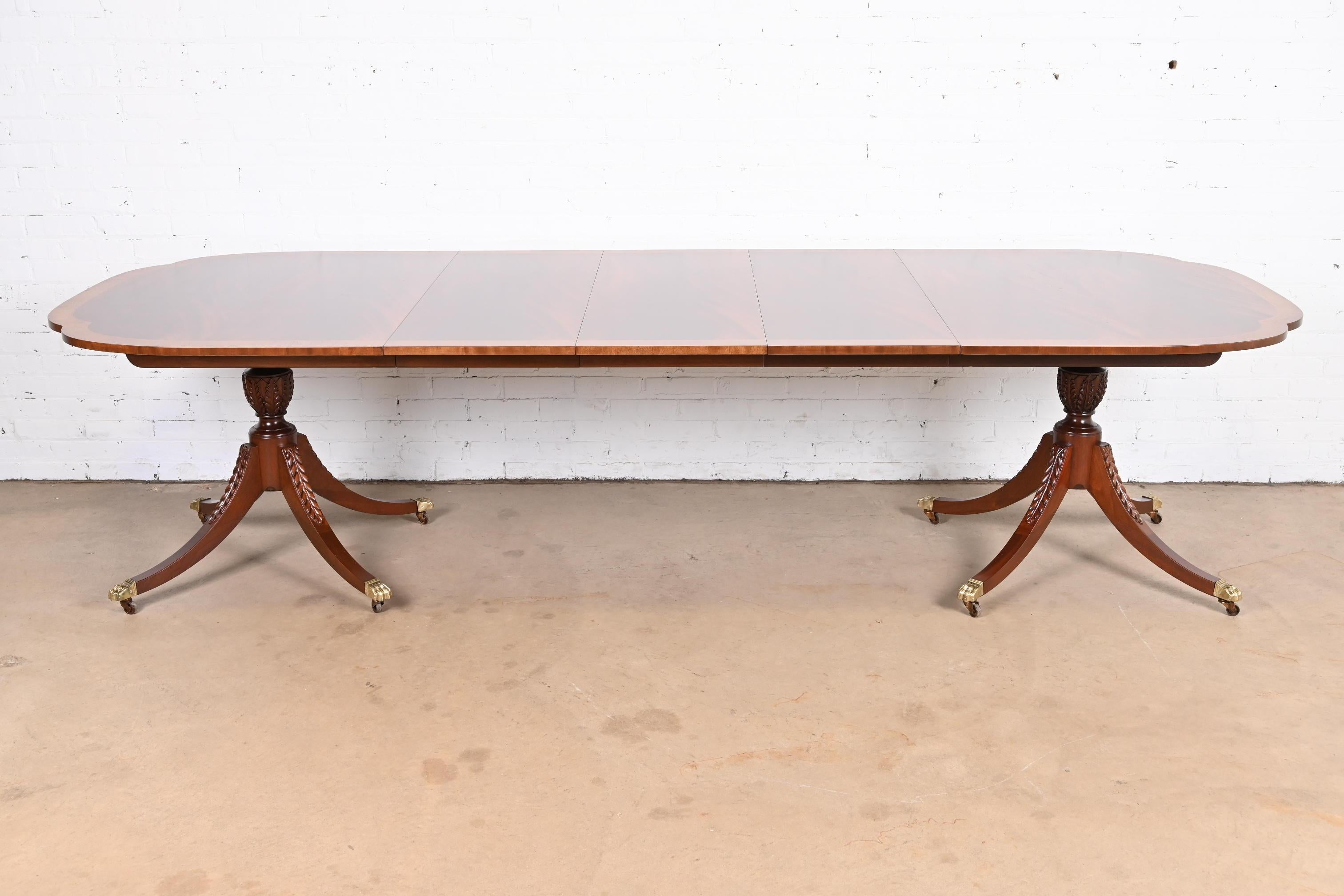 An exceptional Georgian style double pedestal extension dining table

By Baker Furniture, 