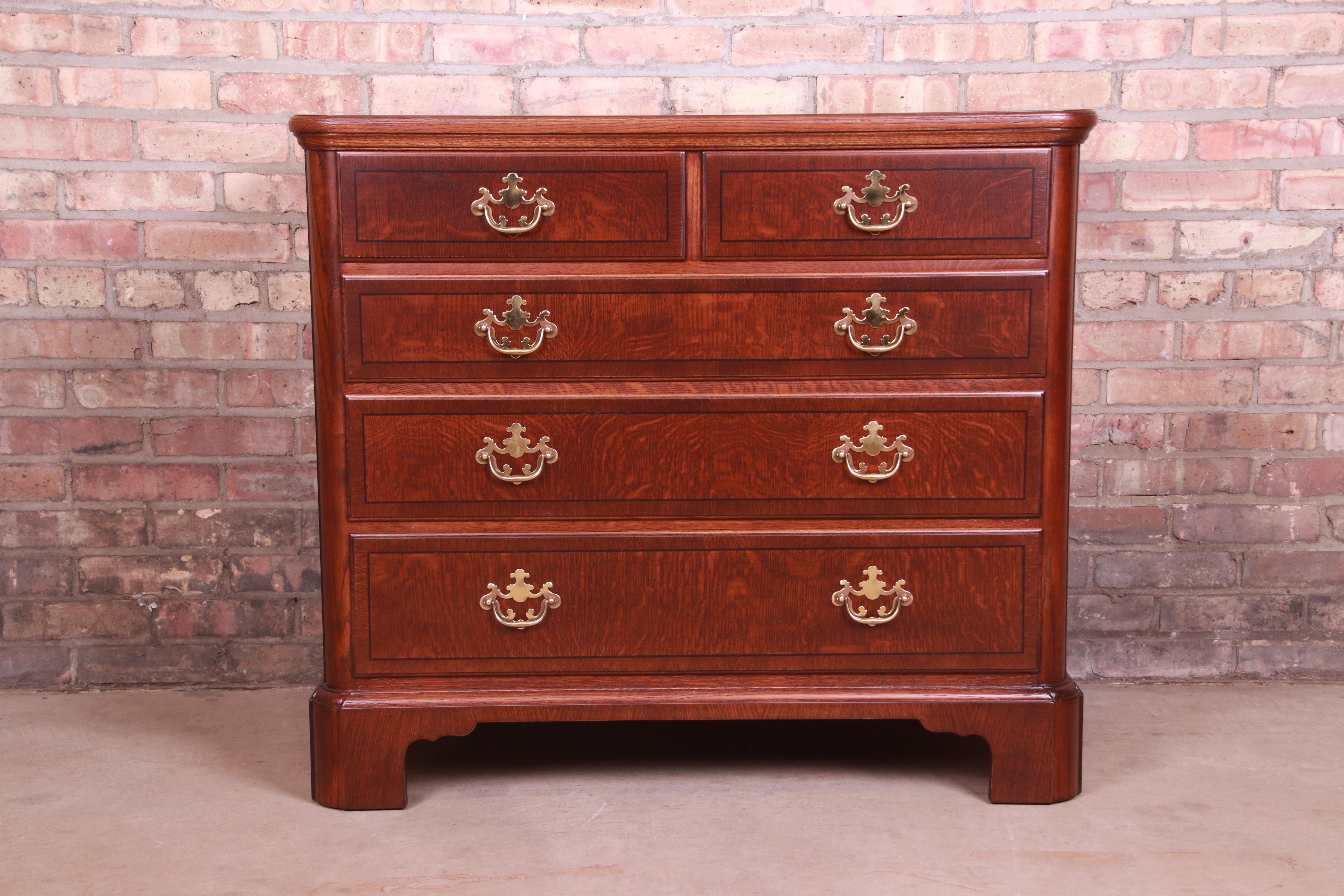 An exceptional Georgian or Chippendale style dresser chest

By Baker Furniture

USA, Circa 1980s

Quarter sawn oak, with original brass hardware.

Measures: 37.75