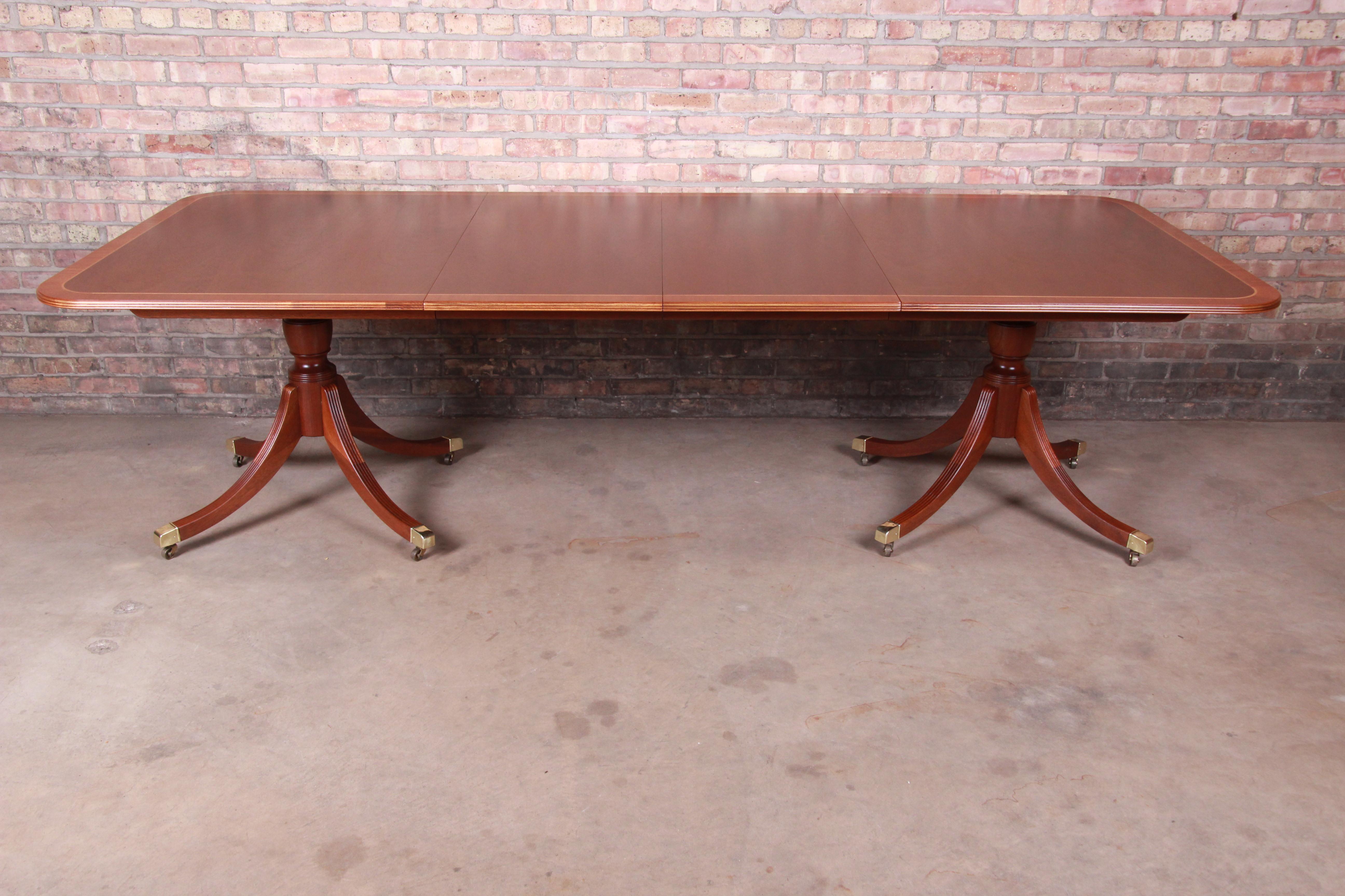 An exceptional Georgian style extension double pedestal dining table

By Baker Furniture 