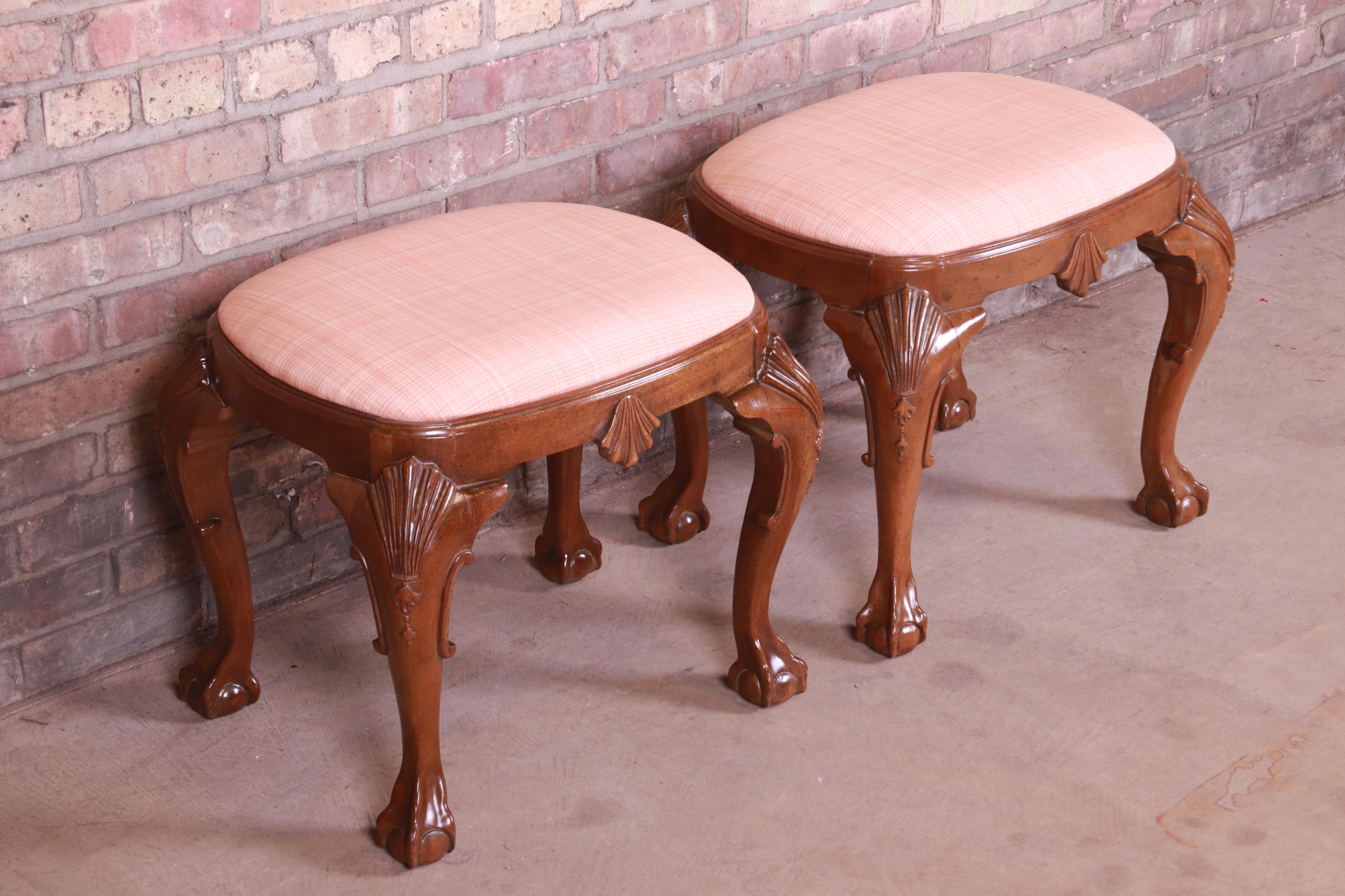 A gorgeous pair of Chippendale style ottomans or stools

By Baker Furniture 