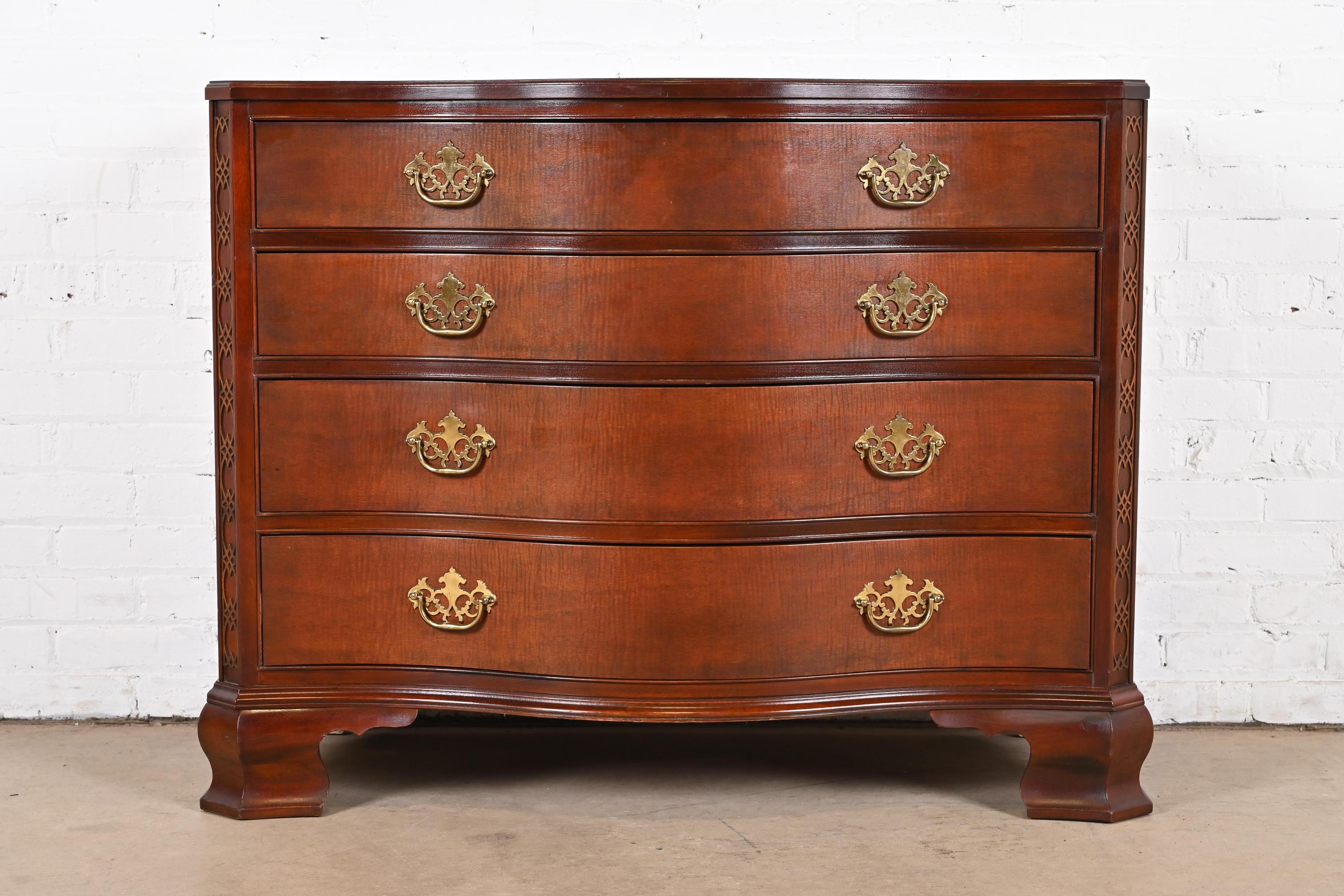 An exceptional Georgian or Chippendale style serpentine front dresser or chest of drawers

By Baker Furniture, 