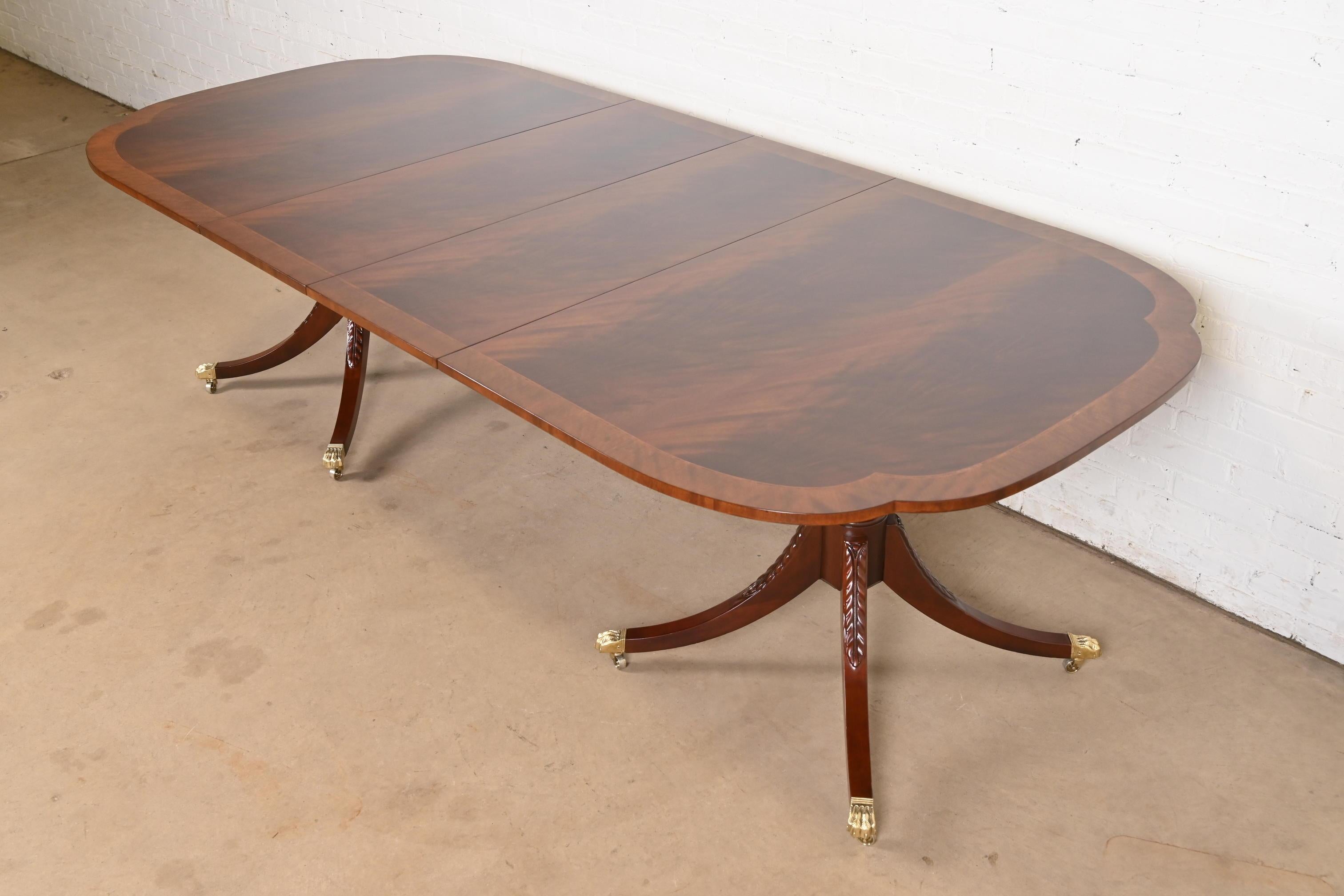 An exceptional Georgian or Regency style double pedestal extension dining table

By Baker Furniture, 