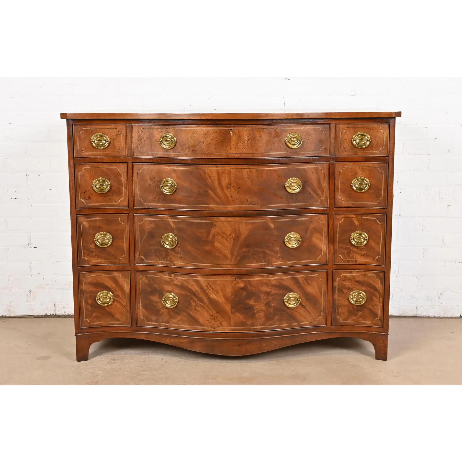A gorgeous Georgian or Chippendale style serpentine front ten-drawer dresser or chest of drawers

By Baker Furniture, 