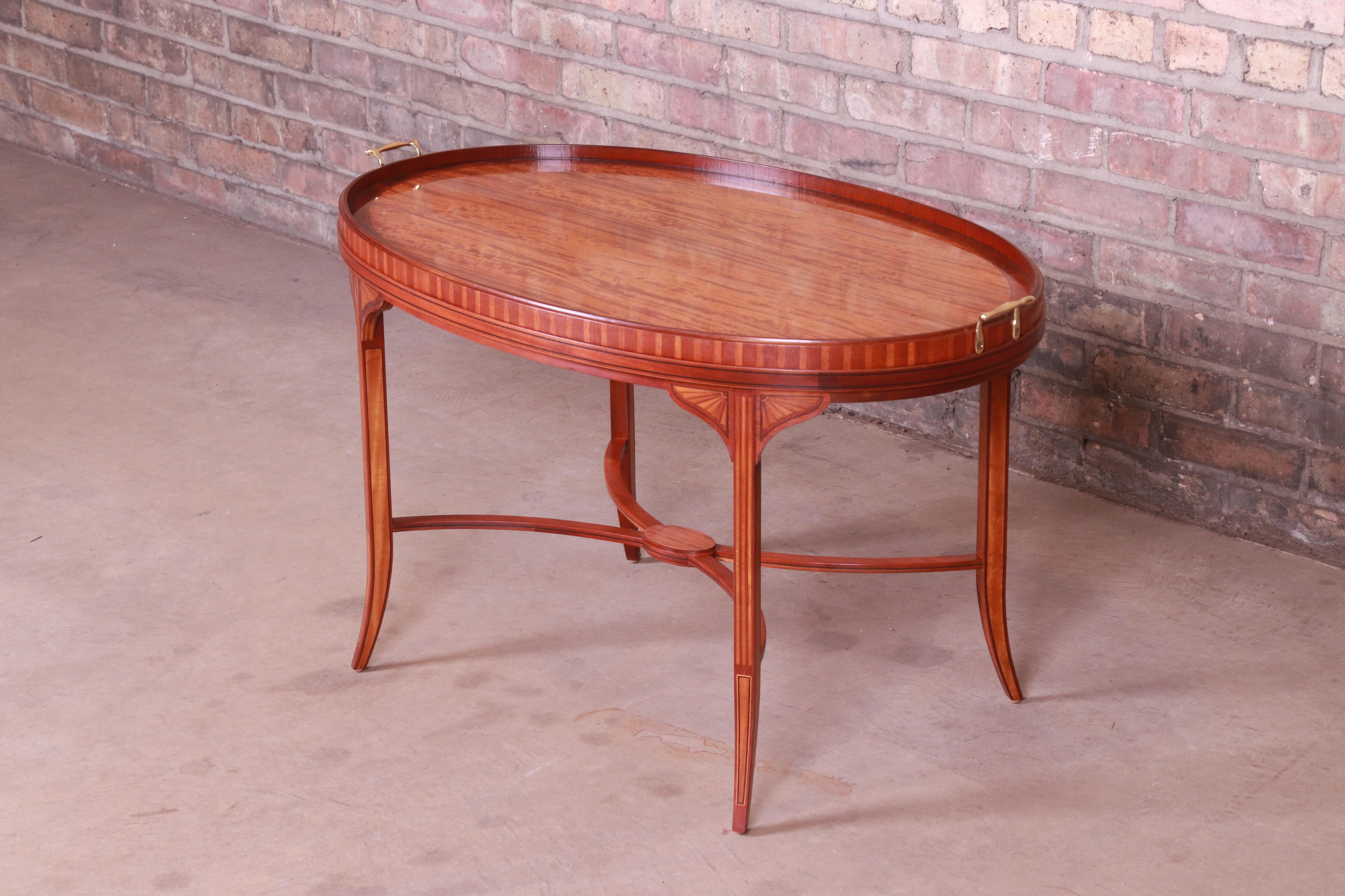 An exceptional Federal or Georgian style coffee or tea table

By Baker Furniture 