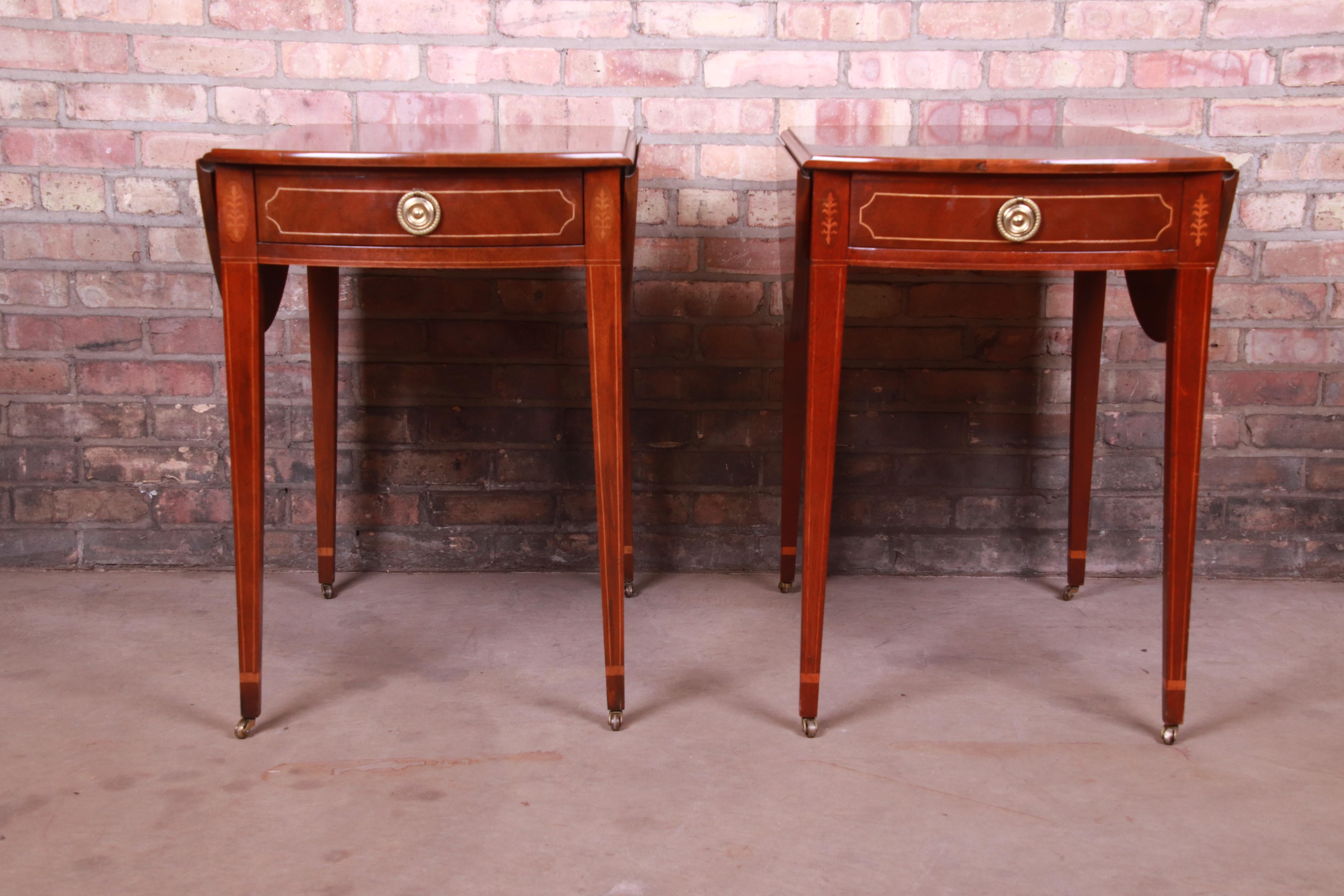 A gorgeous pair of Sheraton style Pembroke nightstands or tea tables

By Baker Furniture 